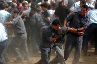 Israeli soldiers and police evacuate settlers from an illegal settlement Israeli soldiers and police evacuate settlers from an illegal settlement