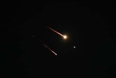 Anti-missile system fires interception missiles as drones and missiles fired from Iran. Anti-missile system fires interception missiles as drones and missiles fired from Iran.