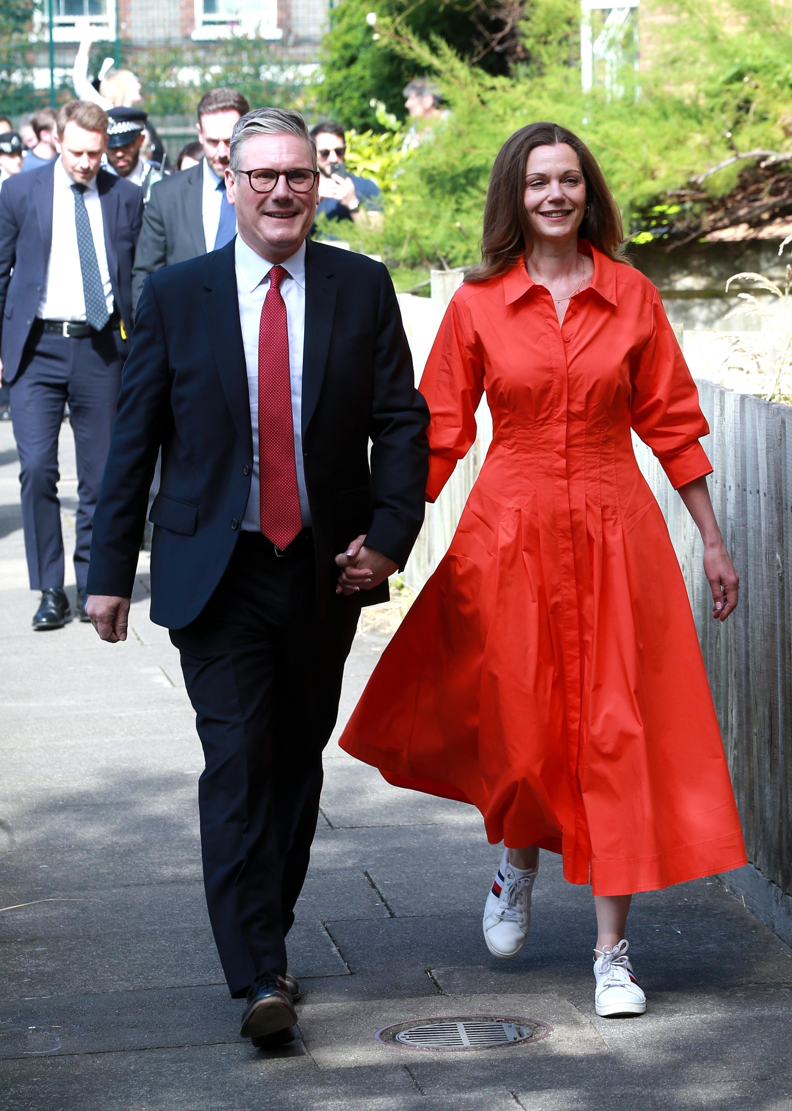 Keir Starmer and his wife Victoria Starmer arrive to cast their votes in the general election in London, England.