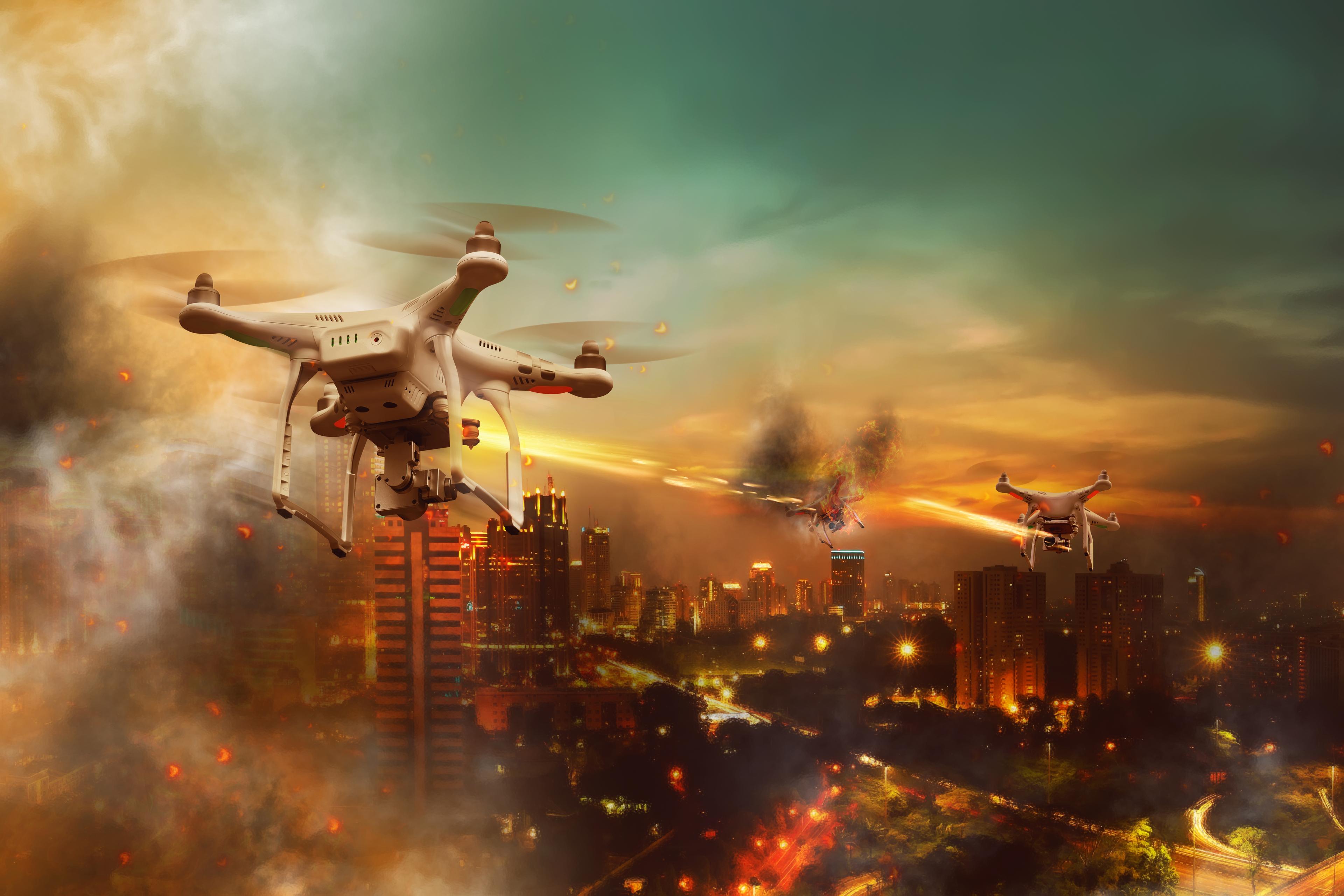 Drones battle over the city at night time Drones battle over the city at night time