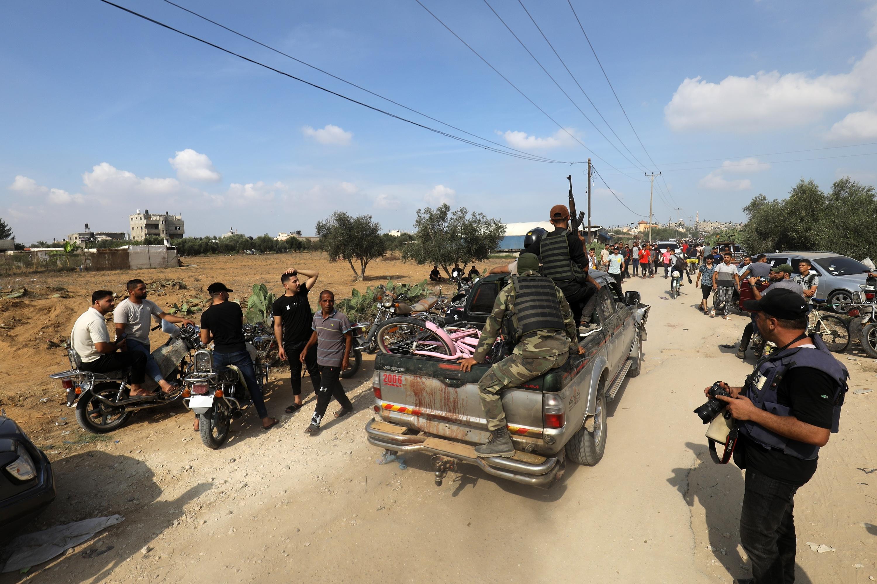 Palestinians storm Israeli territory, east of the city of Khan Yunis, October 7 2023 Palestinians storm Israeli territory, east of the city of Khan Yunis, October 7 2023