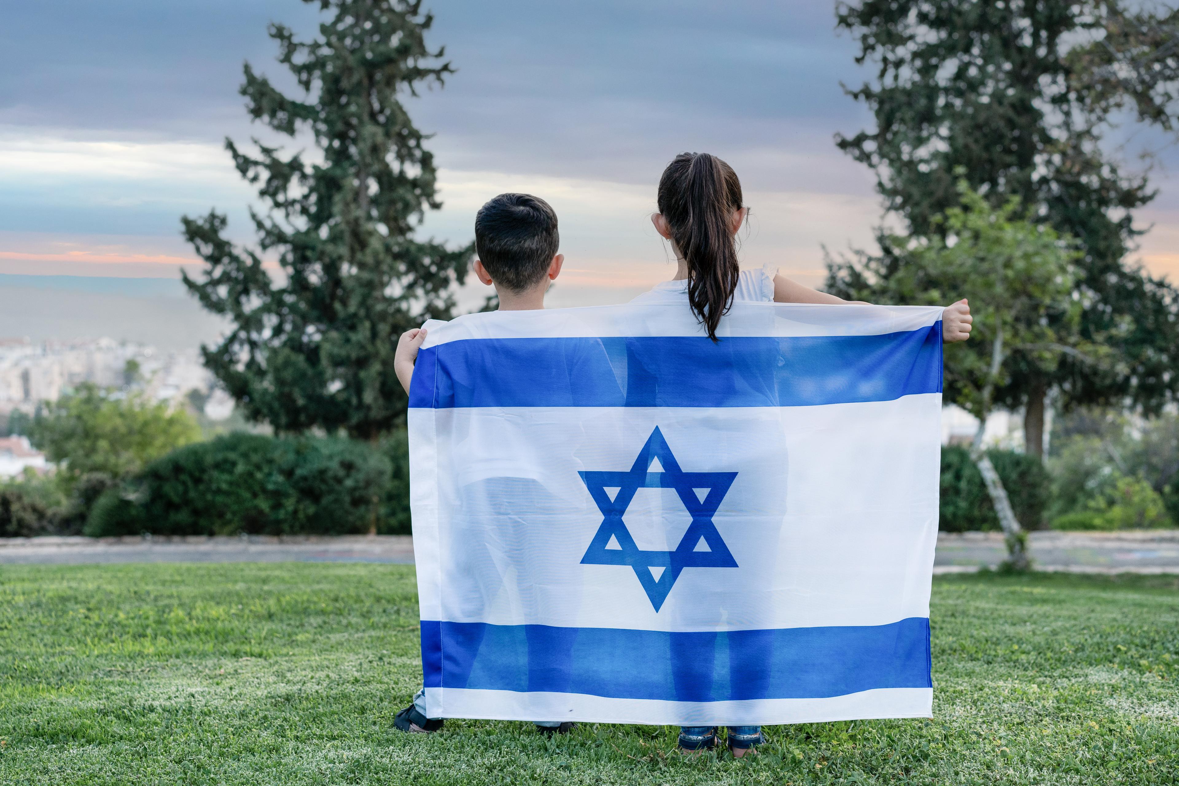 Jewish children standing with the flag of Israel Jewish children standing with the flag of Israel