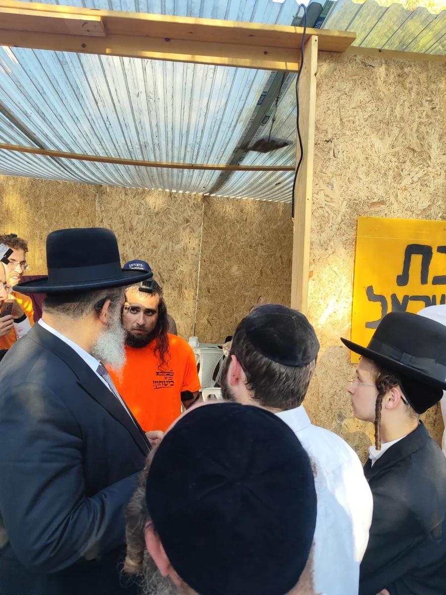 Affixing a mezuza in Eli Azza Affixing a mezuza in Eli Azza
