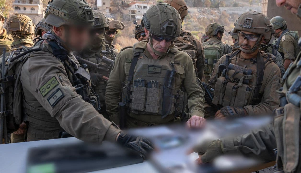 IDF senior officers poring over maps. IDF senior officers poring over maps.