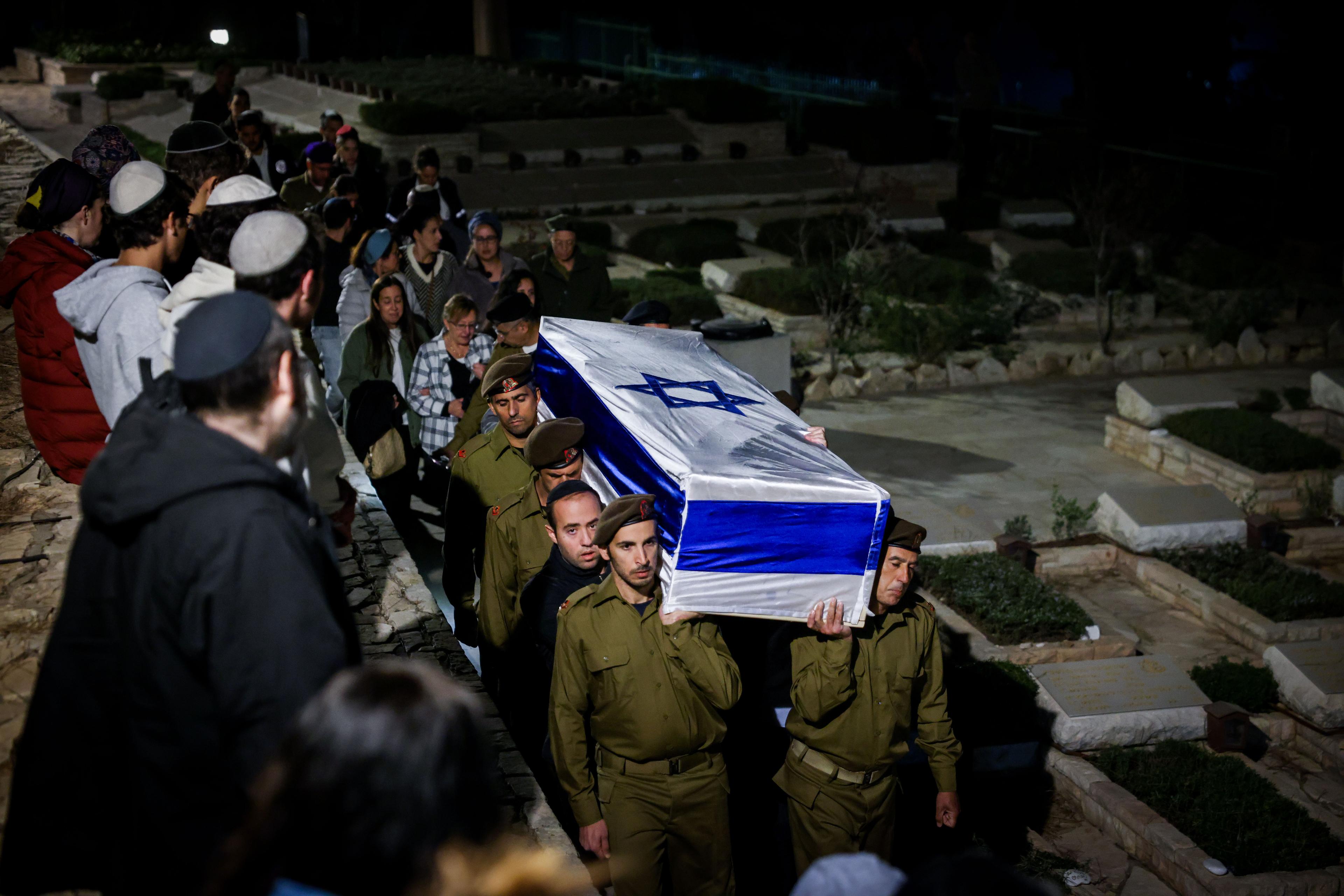People attend the funeral of Israeli soldier Sergeant major (res.) Shmuel Harari at Mount Herzl Military Cemetery in Jerusalem on October 26, 2024 People attend the funeral of Israeli soldier Sergeant major (res.) Shmuel Harari at Mount Herzl Military Cemetery in Jerusalem on October 26, 2024