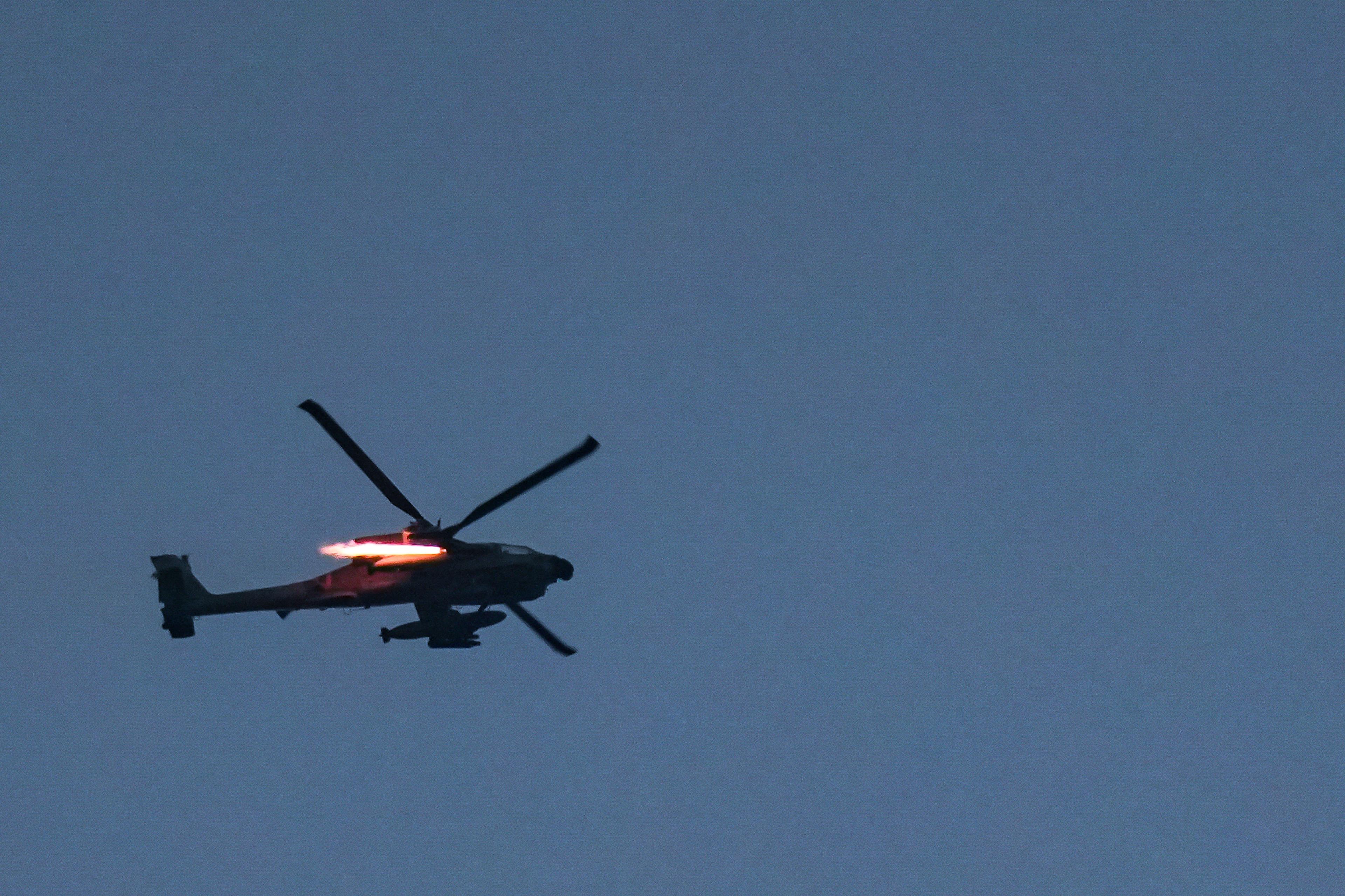 An Israeli military helicopter fly near the Israeli border with Lebanon