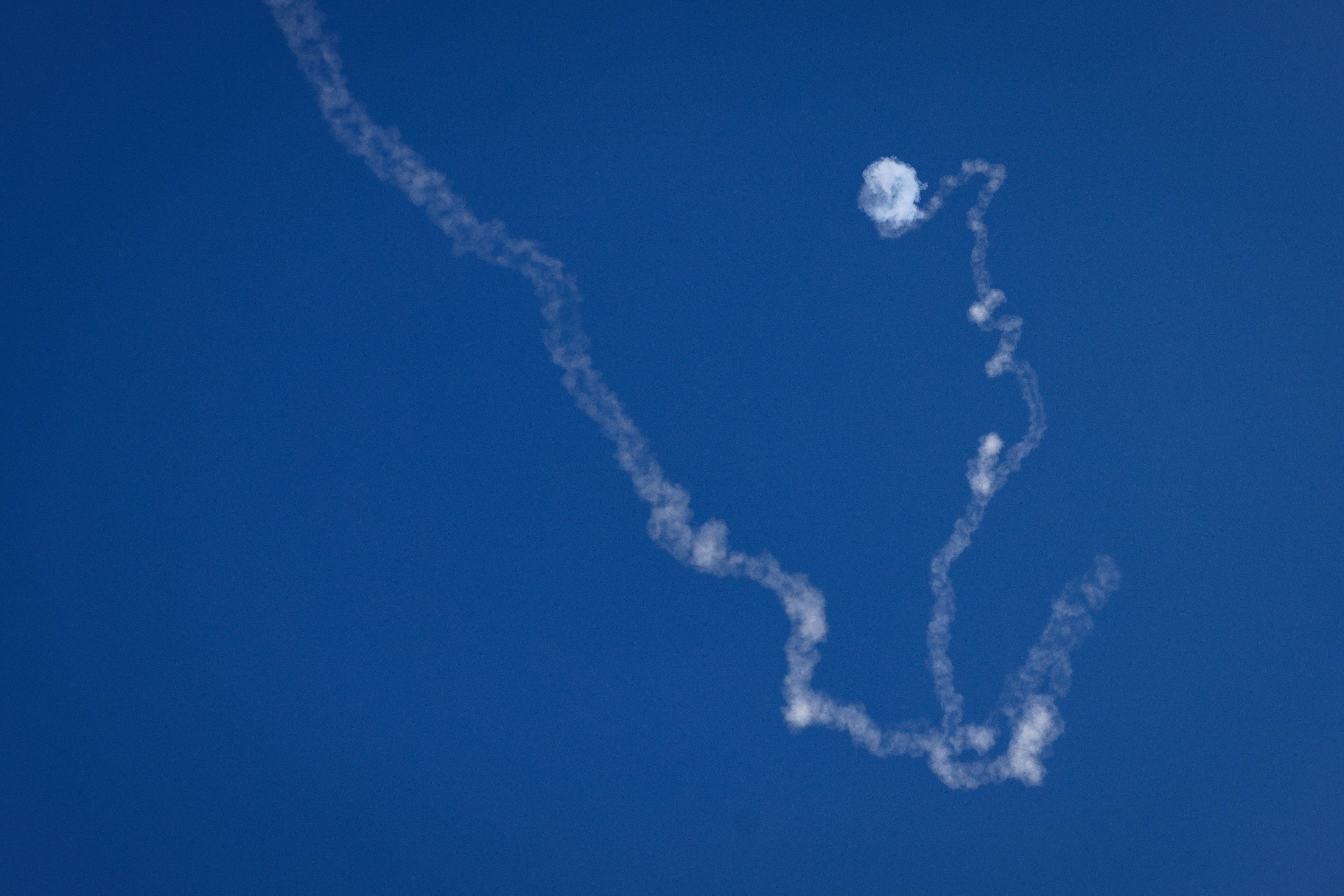 An Iron dome anti-missile system fires interception missile as rockets are fired from Lebanon