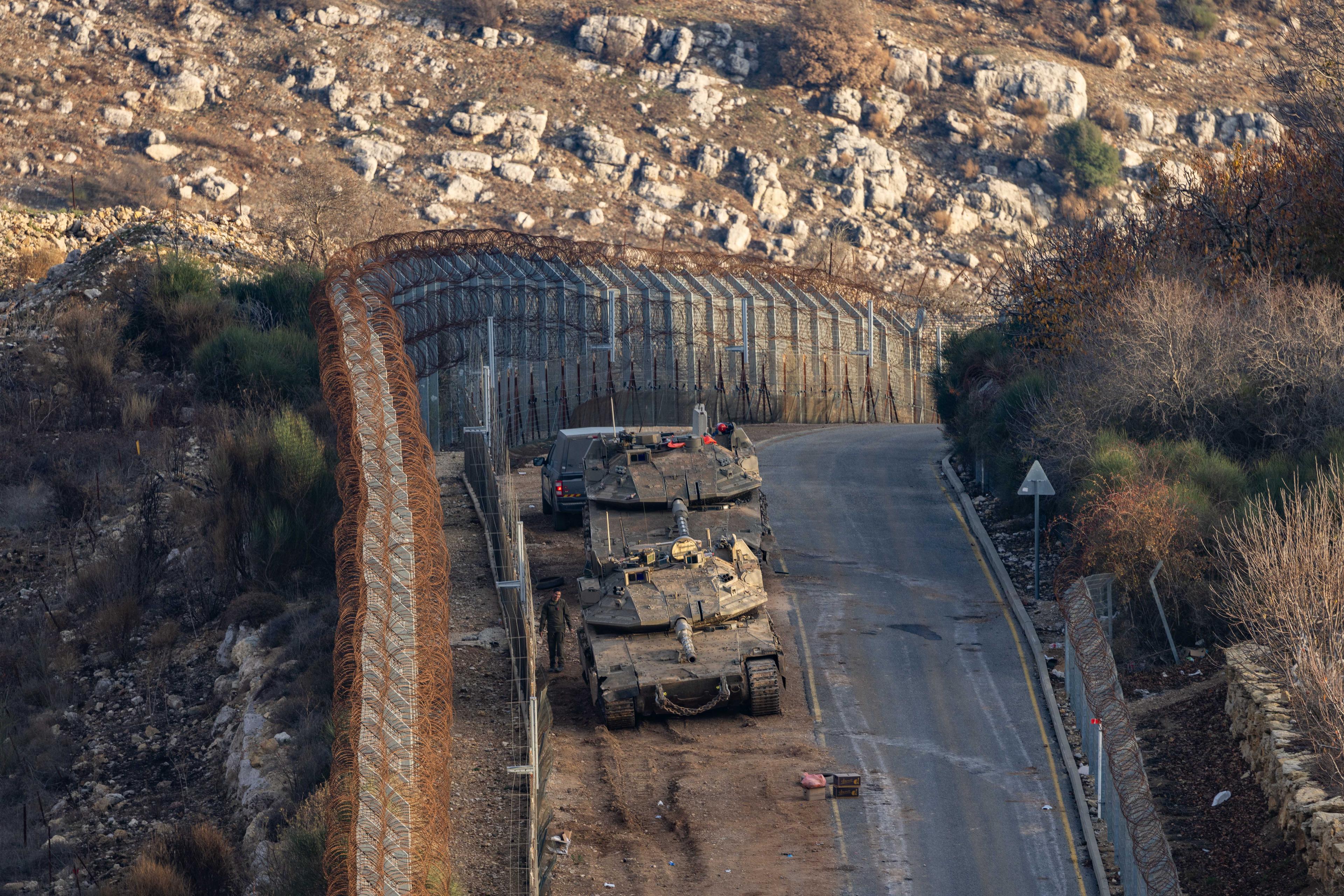 Israeli soldiers on the border fence on the Israeli border with Syria, northern Israel, December 9, 2024