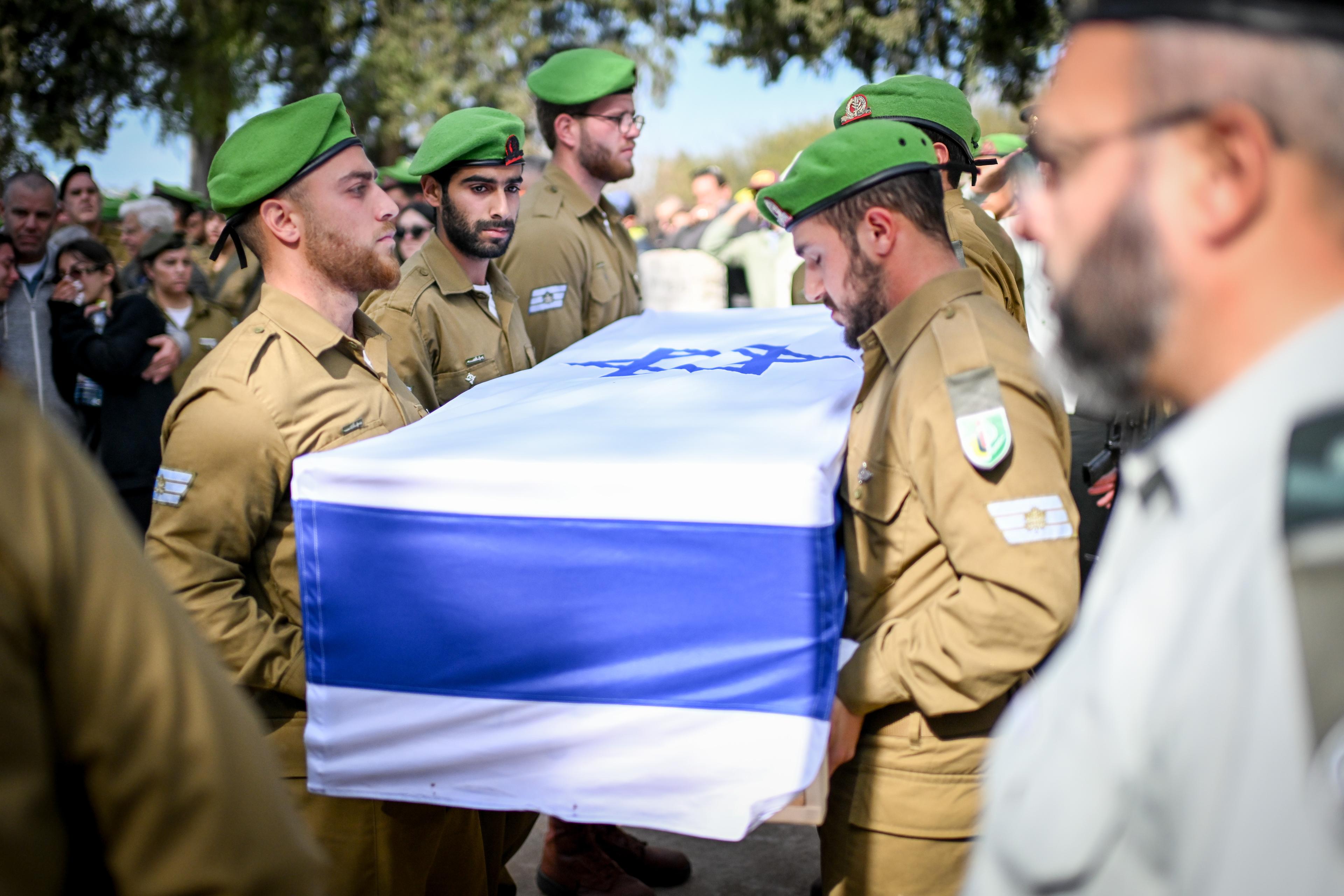 Family and friends attend the funeral of Israeli soldier First Sgt Yahav Hadar who was killed in battle in the Gaza Strip, at a military cemetery in Kfar Tavor, January 14, 2025 Family and friends attend the funeral of Israeli soldier First Sgt Yahav Hadar who was killed in battle in the Gaza Strip, at a military cemetery in Kfar Tavor, January 14, 2025