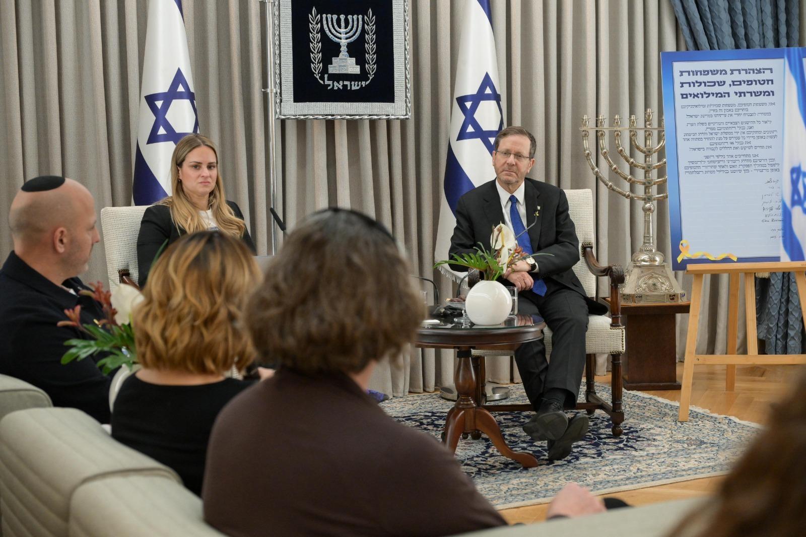 President Herzog meets with hostage families. President Herzog meets with hostage families.