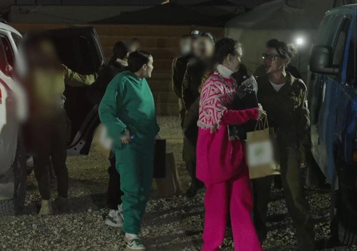The released hostages being received by the IDF with braids similar to previous hostages released