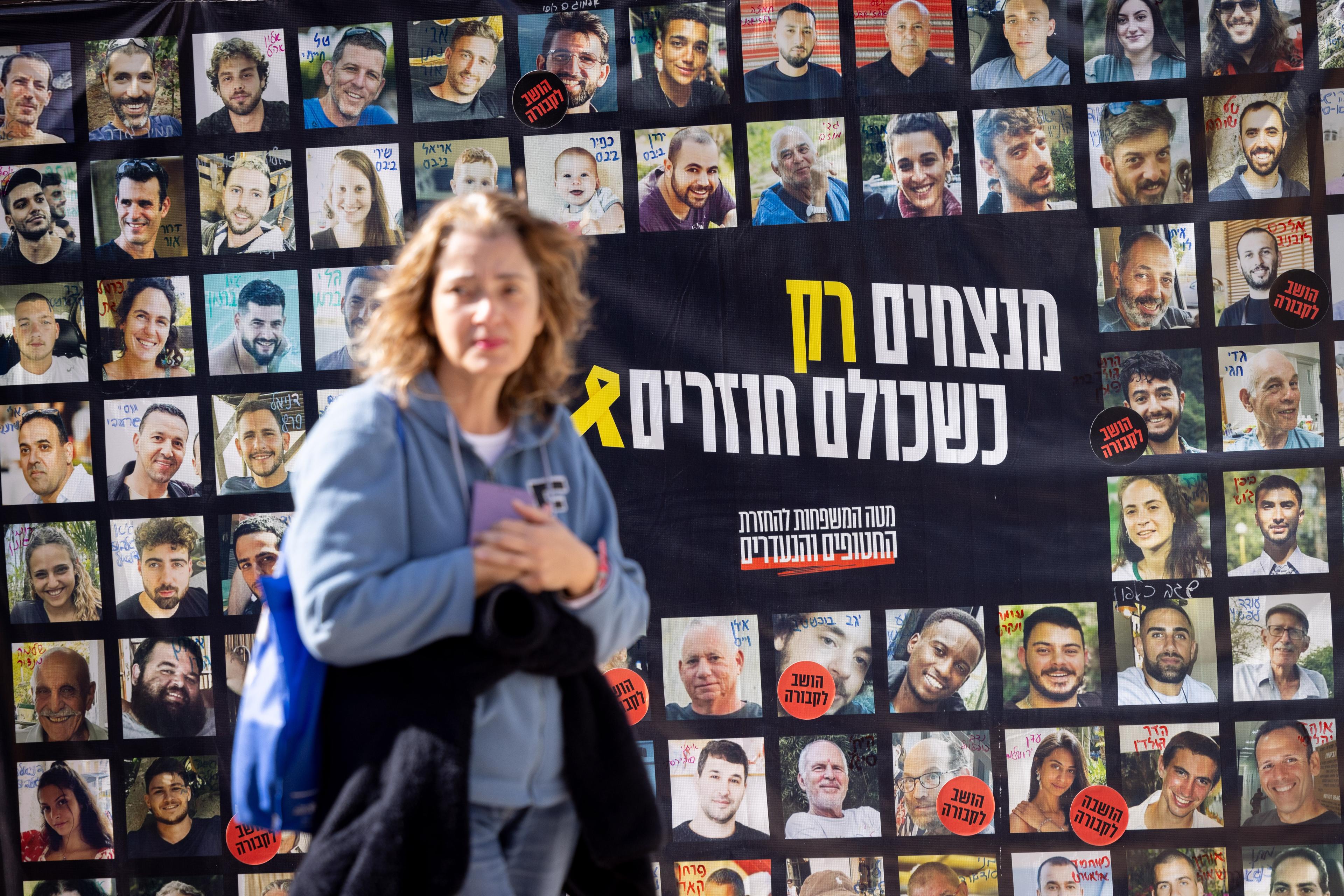 Poster with pictures of the hostages. Poster with pictures of the hostages.