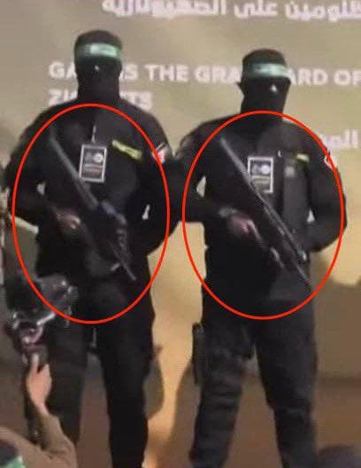 Hamas members holding Israeli Tavor rifles at the rally last Saturday Hamas members holding Israeli Tavor rifles at the rally last Saturday