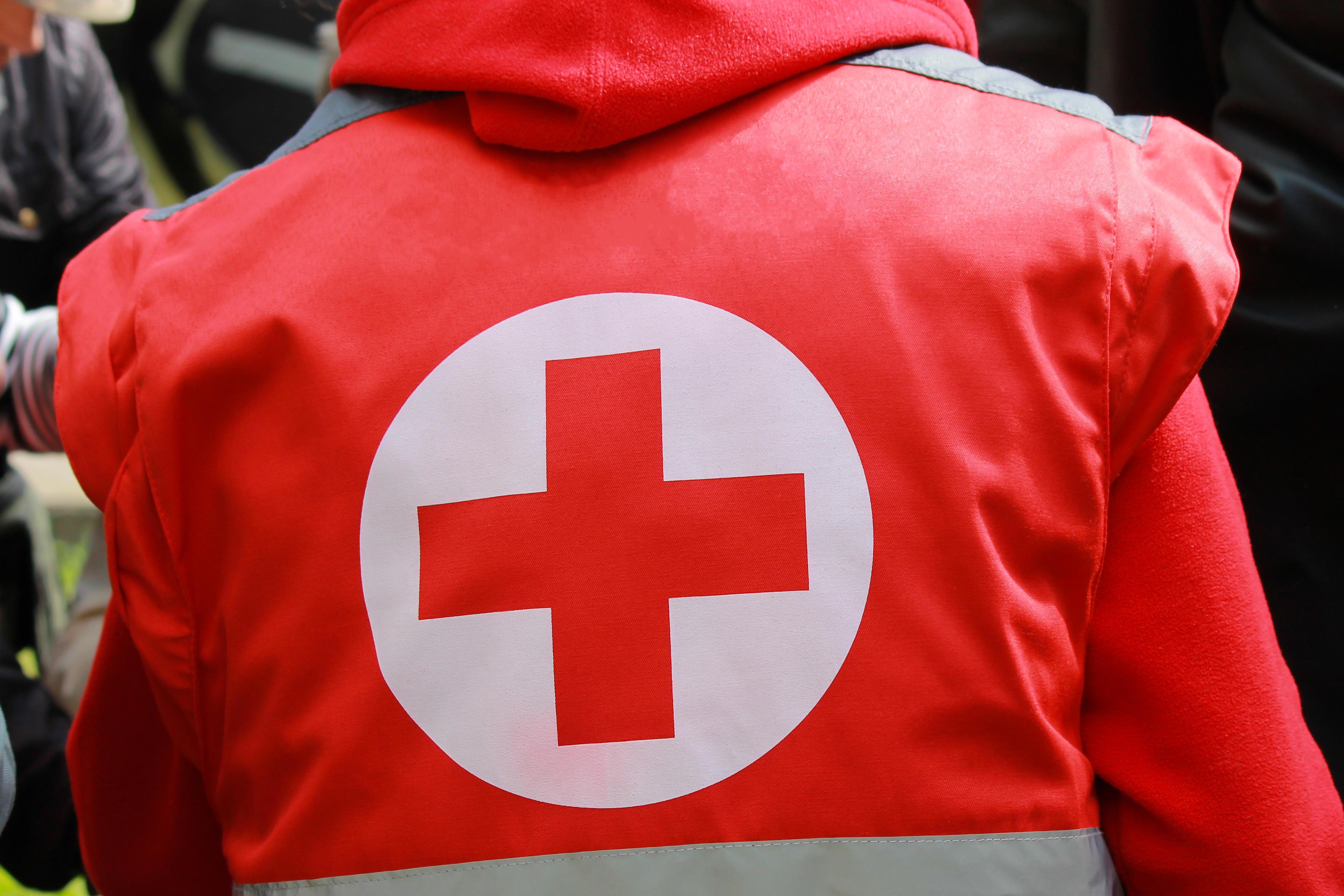 Medical staff in uniform with Red Cross 
