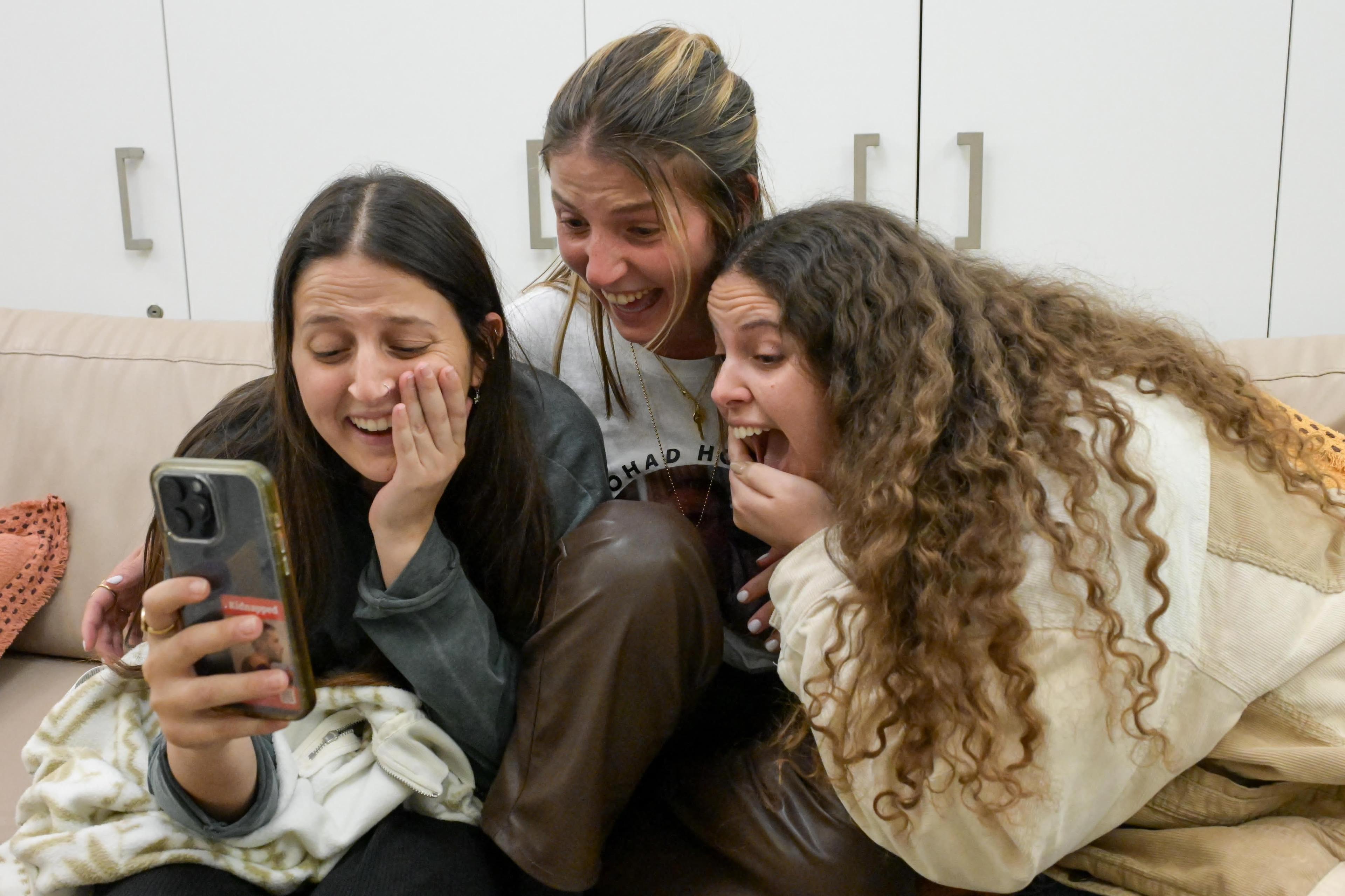 Ohad Ben Ami's daughters watch footage of his release