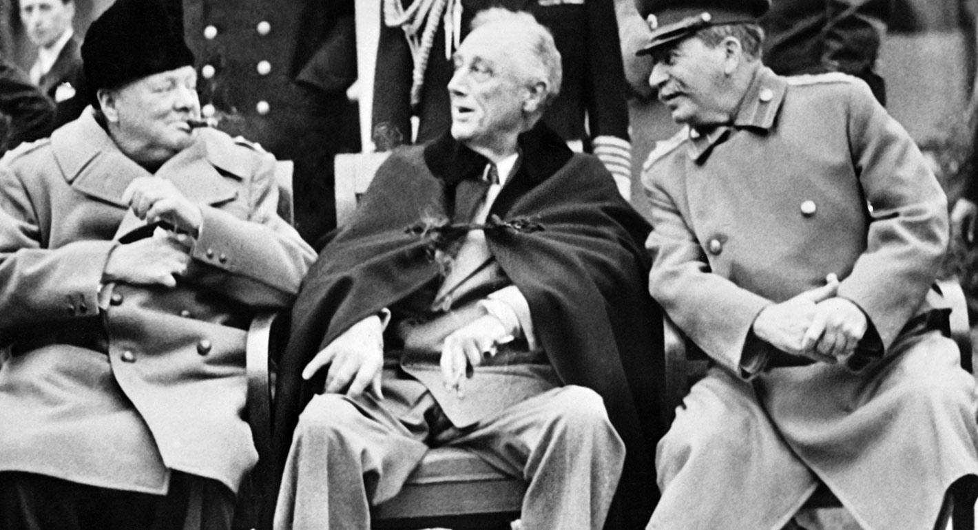 Winston Churchill, Franklin Delano Roosevelt and Joseph Stalin pose at the start of the Conference of the Allied powers in Yalta, Crimea, on February 4, 1945.