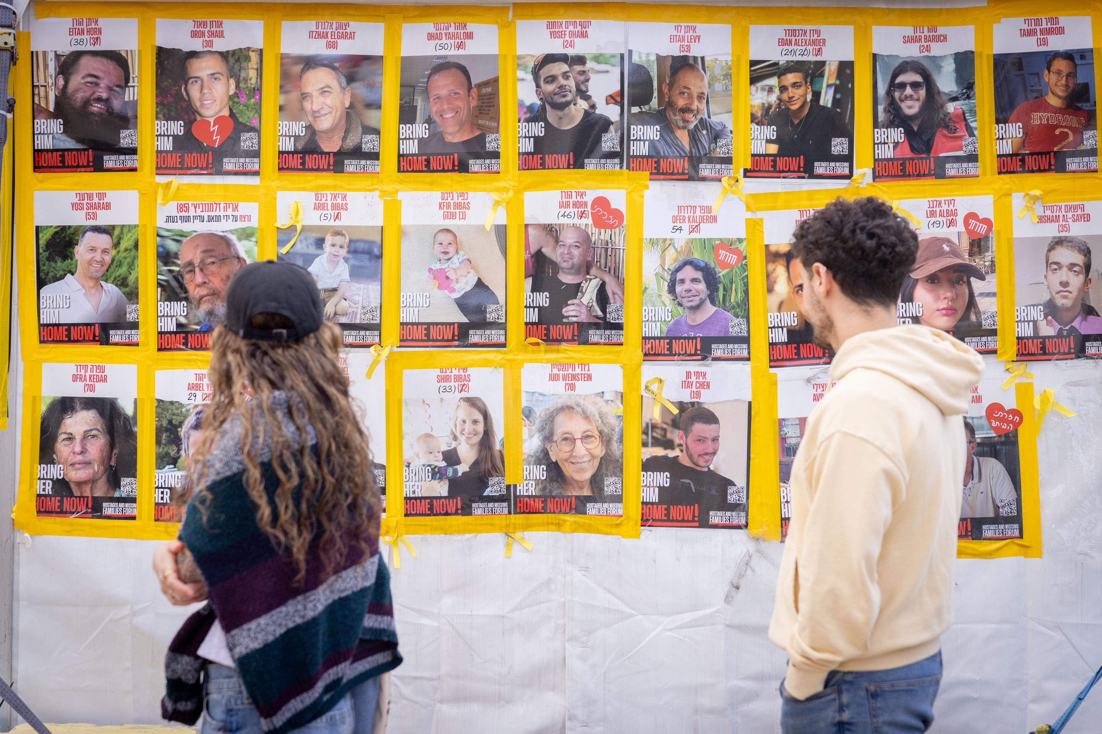 Passing pictures of hostages.