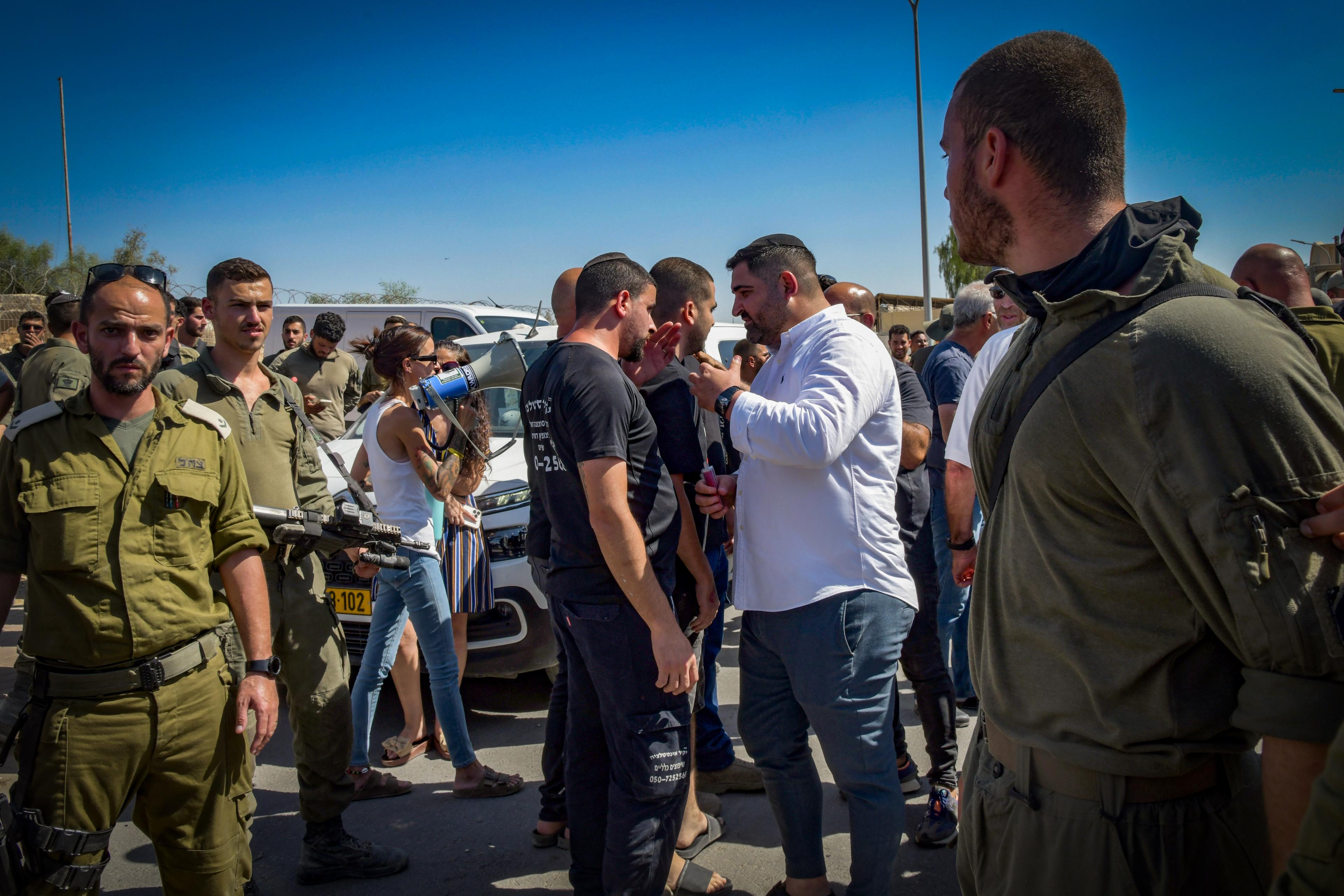 Demonstrates protest against the detention of Israeli reserve soldiers suspected of assaulting a Hamas terrorist, at the Sde Teiman military base near Beersheba, July 29, 2024