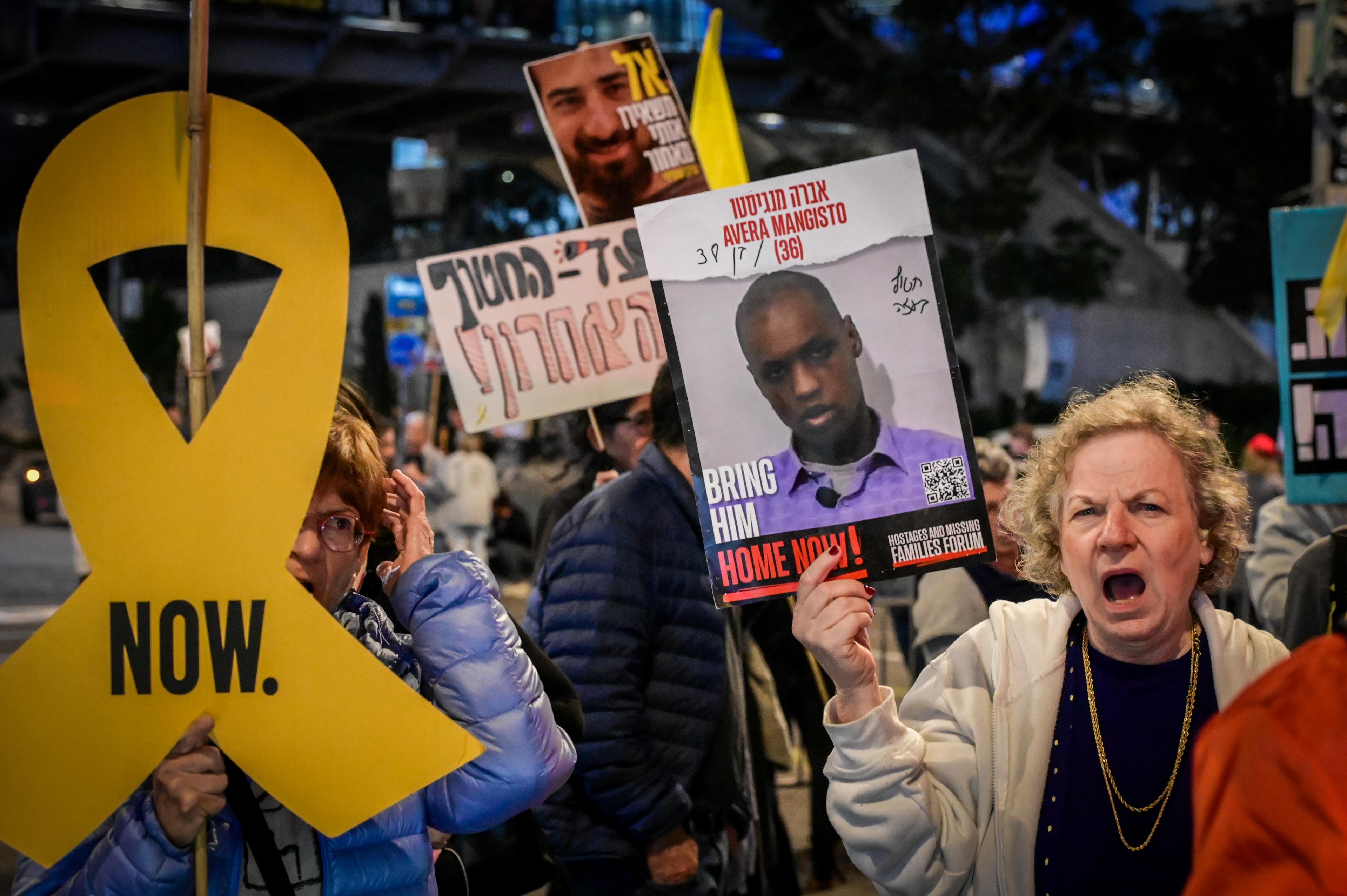 Demonstrators protest for the release of Israelis held hostage in the Gaza Strip, outside Hakirya Base in Tel Aviv, February 18, 2025.