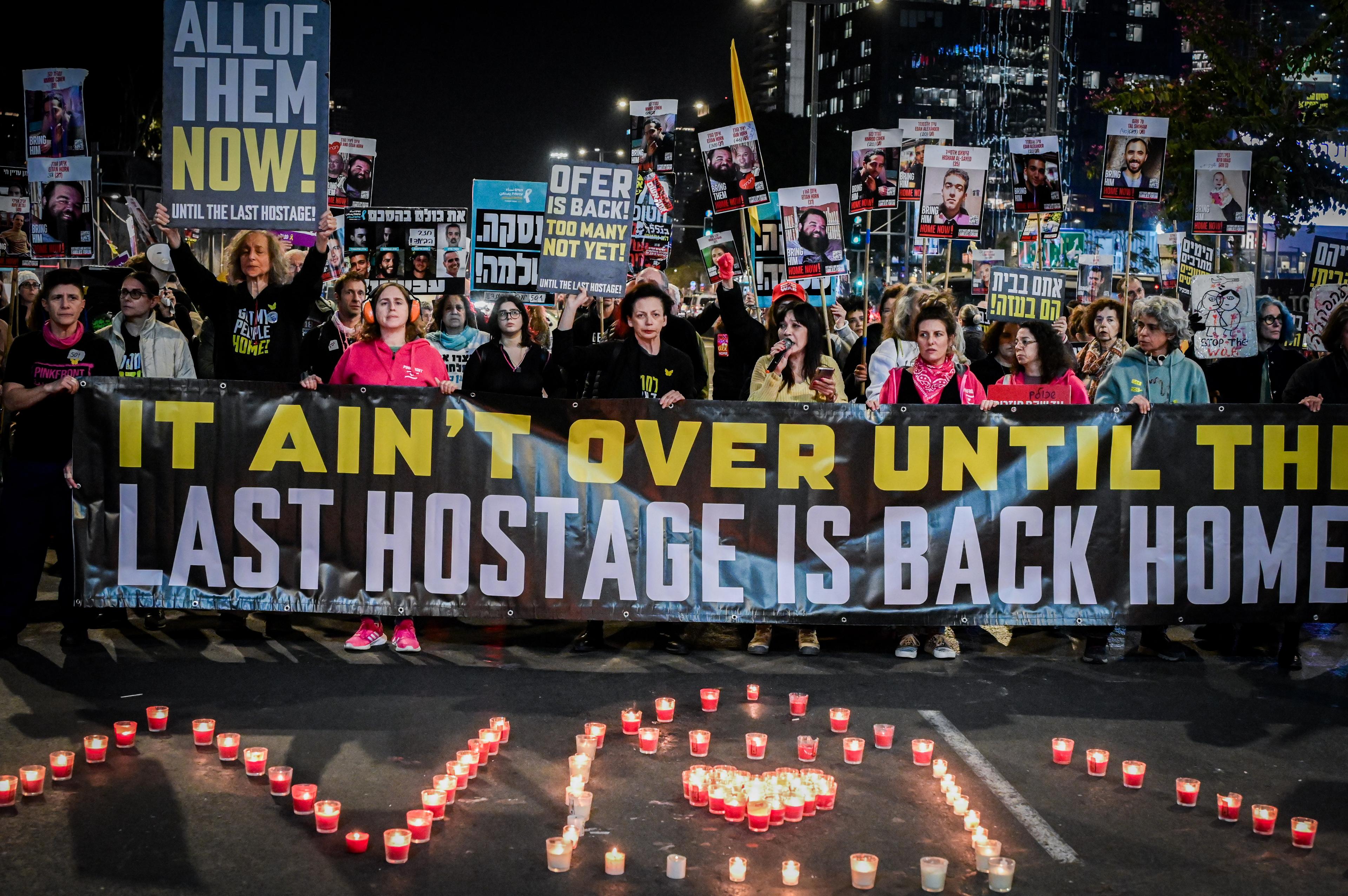 Demonstrators protest for the release of Israelis held hostage in the Gaza Strip, outside Hakirya Base in Tel Aviv, February 18, 2025. Demonstrators protest for the release of Israelis held hostage in the Gaza Strip, outside Hakirya Base in Tel Aviv, February 18, 2025.