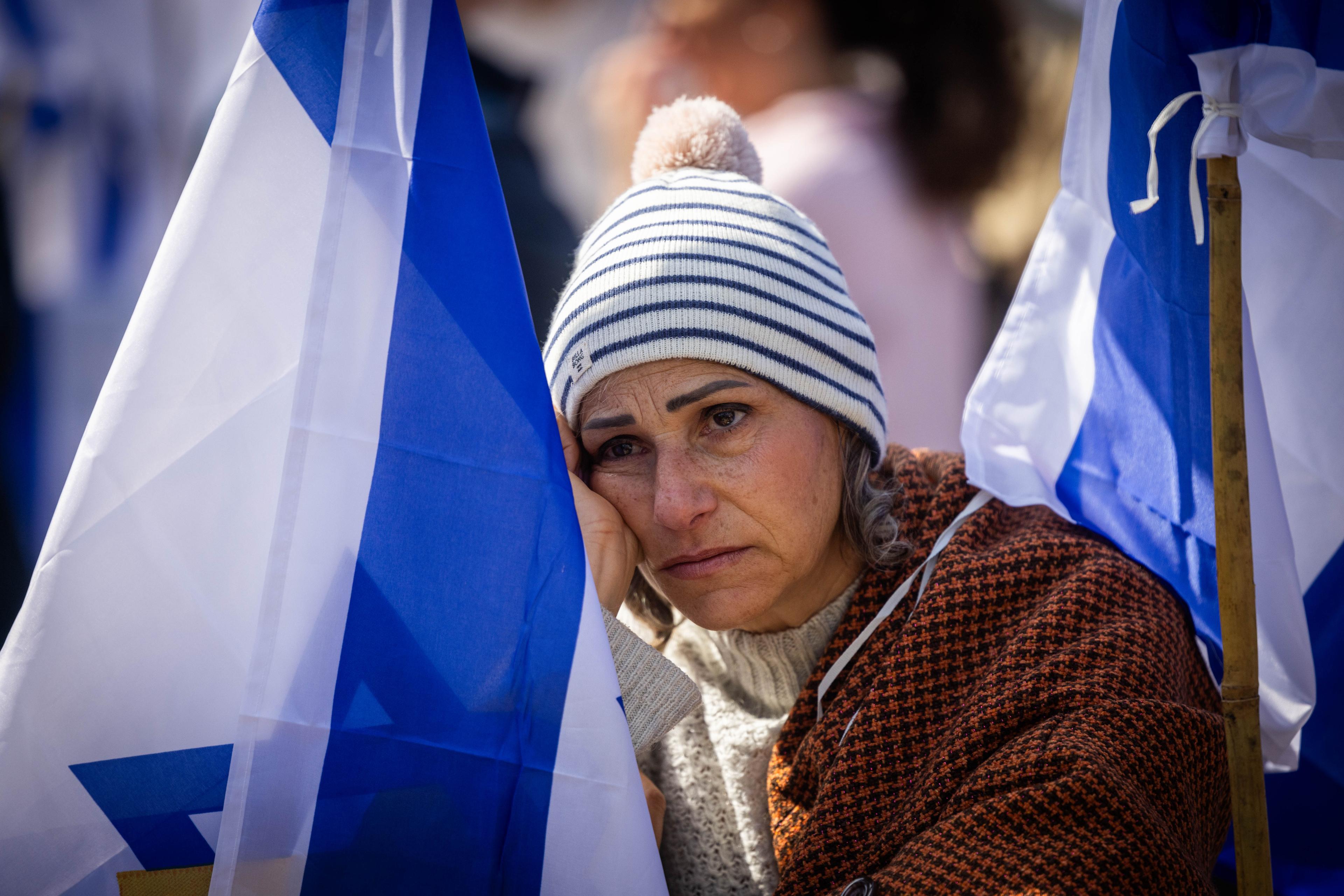 People gather at Hostage square in Tel Aviv, on the day of the release of the bodies of four Israeli hostages from Hamas captivity, February 20, 2025