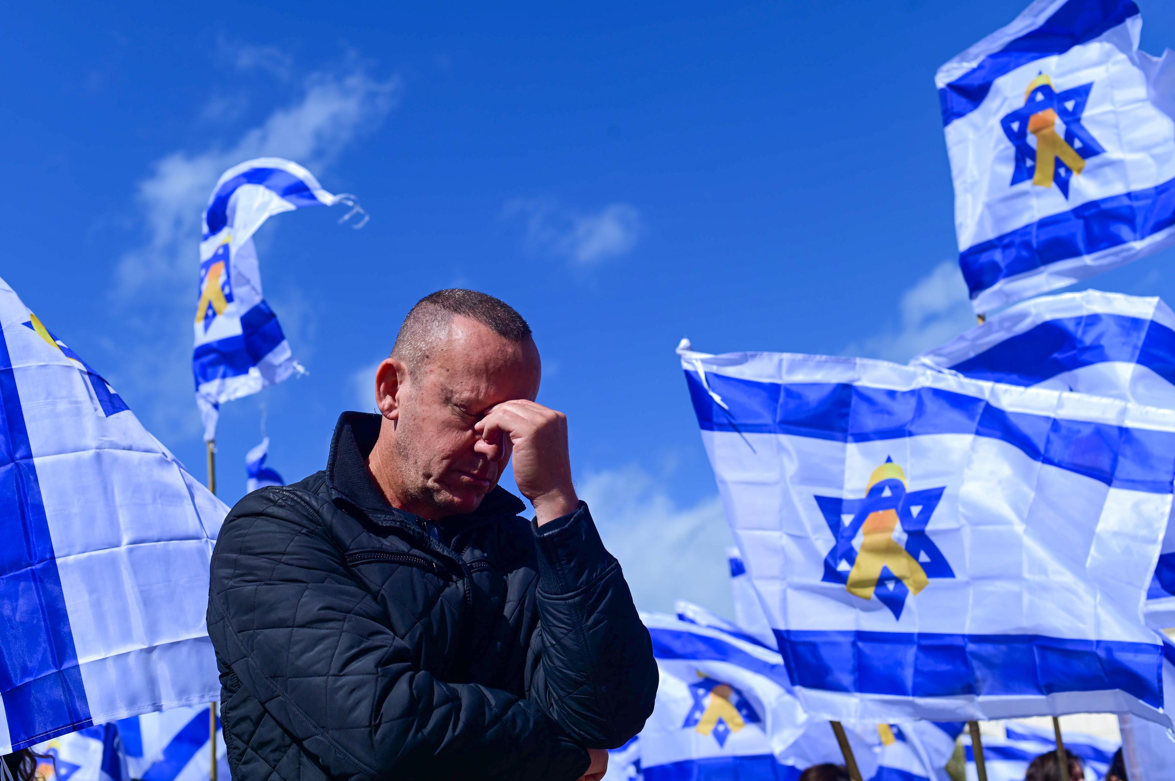 People gather at Hostage square in Tel Aviv, on the day of the release of the bodies of four Israeli hostages from Hamas captivity, February 20, 2025. 