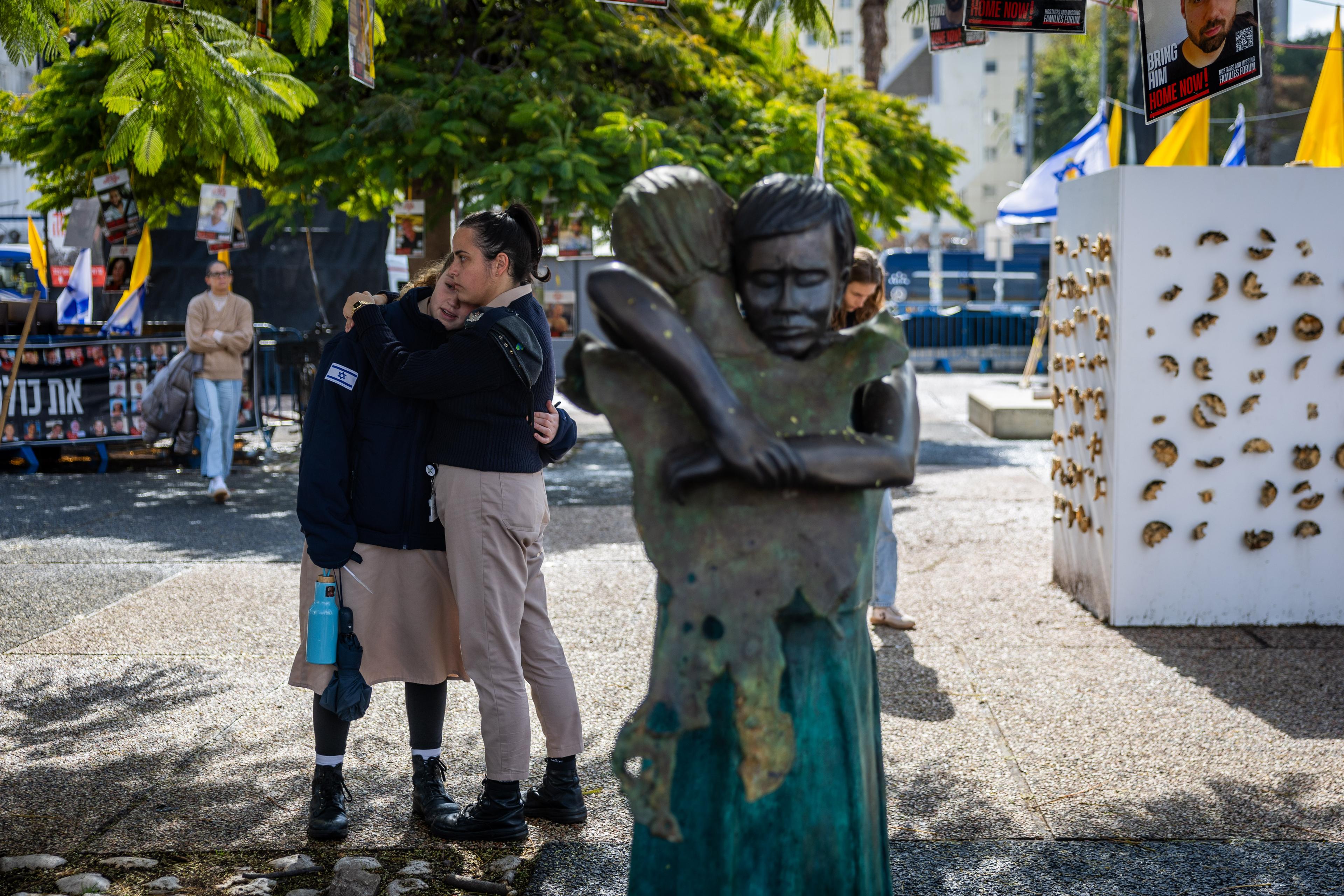 People gather at Hostage square in Tel Aviv, on the day of the release of the bodies of four Israeli hostages from Hamas captivity, February 20, 2025. 