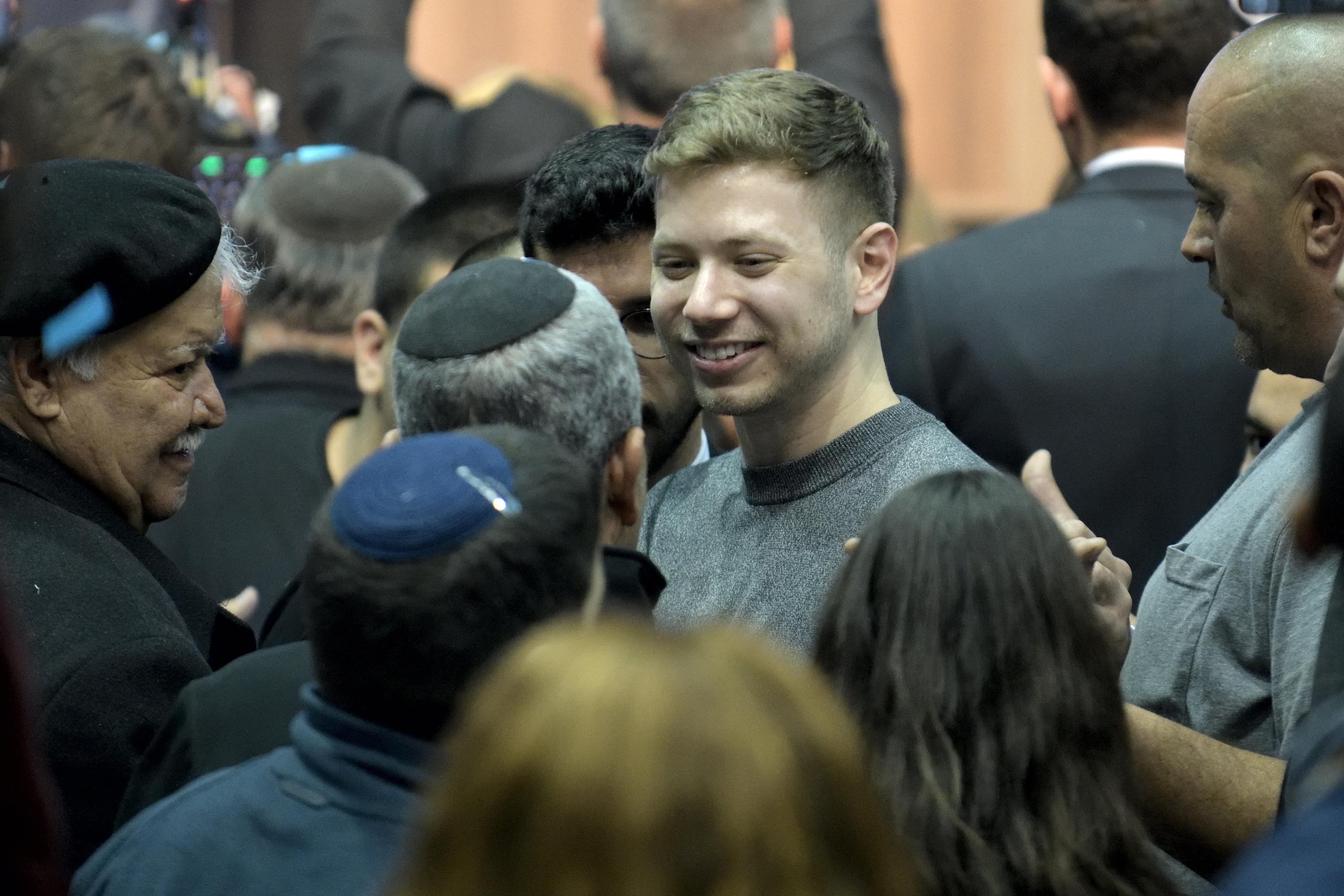 Yair Netanyahu, the son Israeli Prime Minister Benjamin Netanyahu, with supporters after the release of exit polls results of the Israeli general election, at the Likud party's headquarters in Tel Aviv, 2020