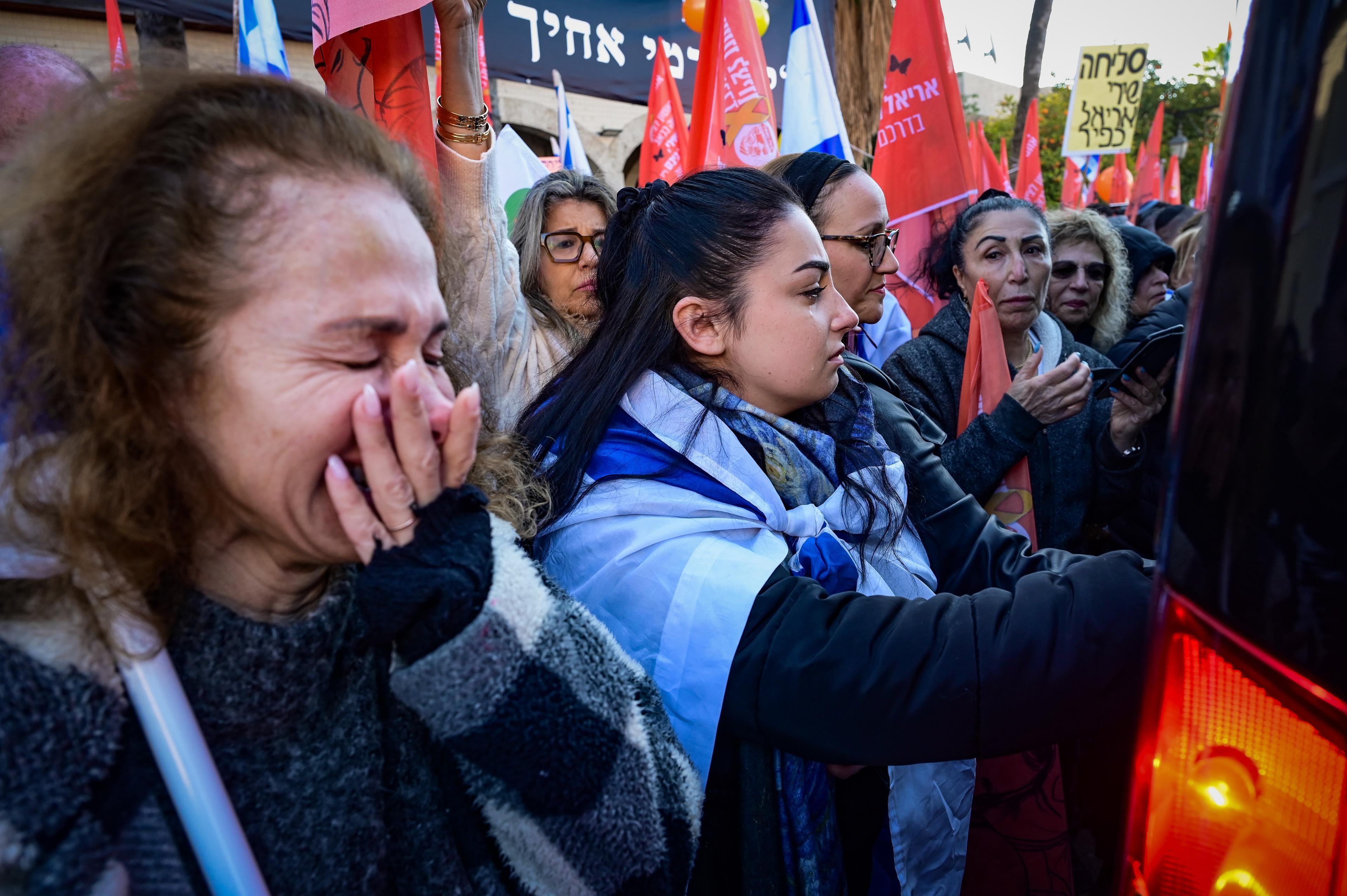 People pay their respects during the funeral service of late Israeli hostages Shiri Bibas and her children Ariel and Kfir in Rishon LeZion, February 26, 2025. 