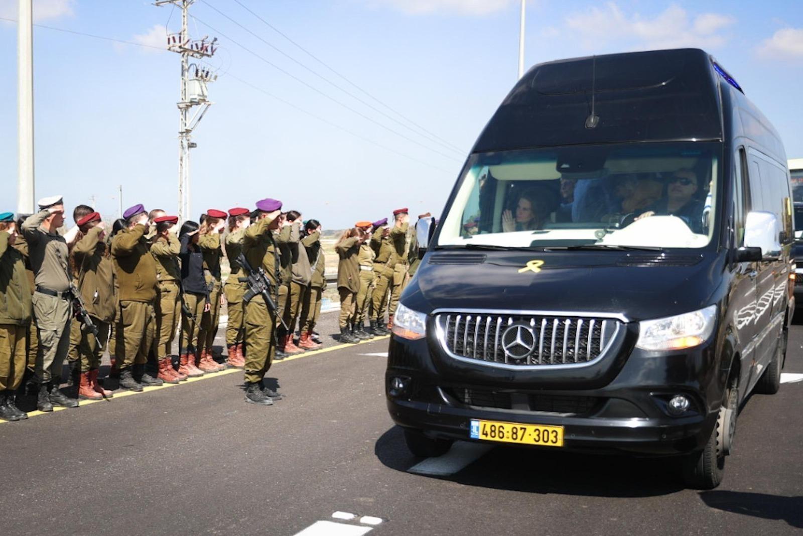 IDF soldiers salute the bodies of murdered Bibas family
