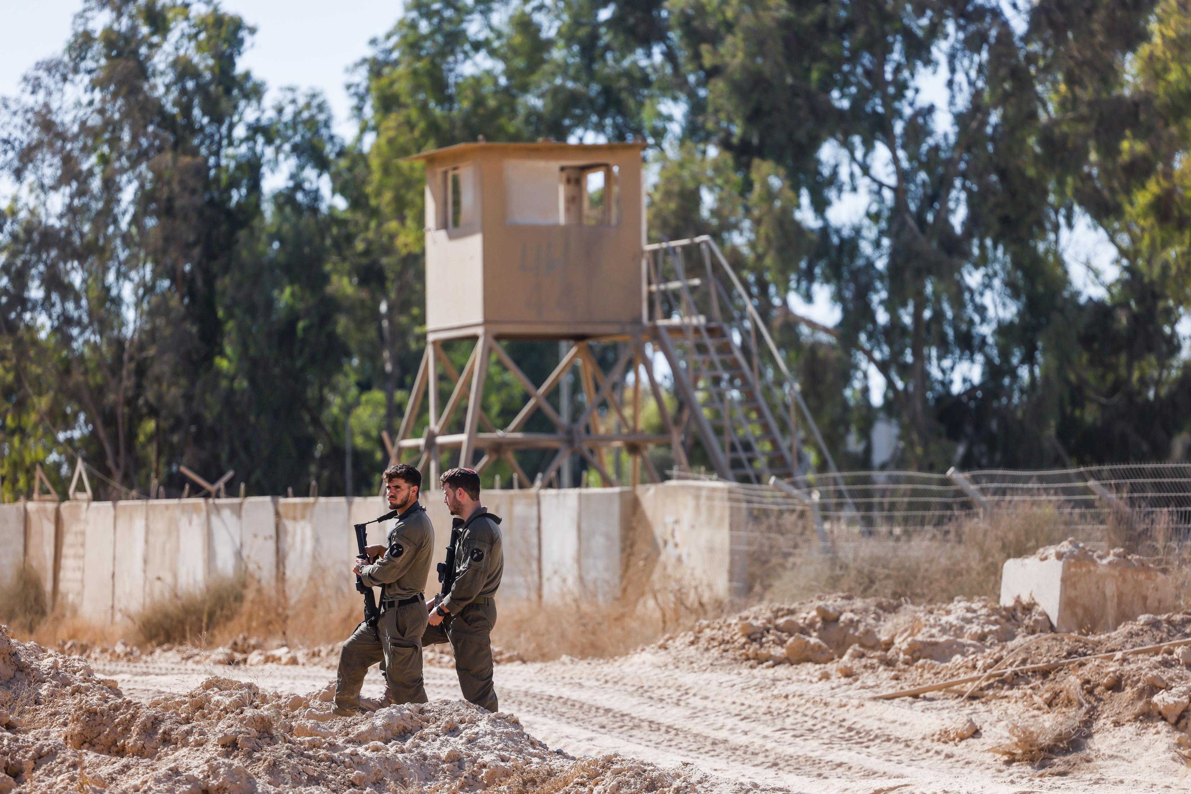 sraeli soldiers guard outside the Nahal Oz surveillance outpost near the Israeli border with the Gaza Strip, July 17, 2024. 
