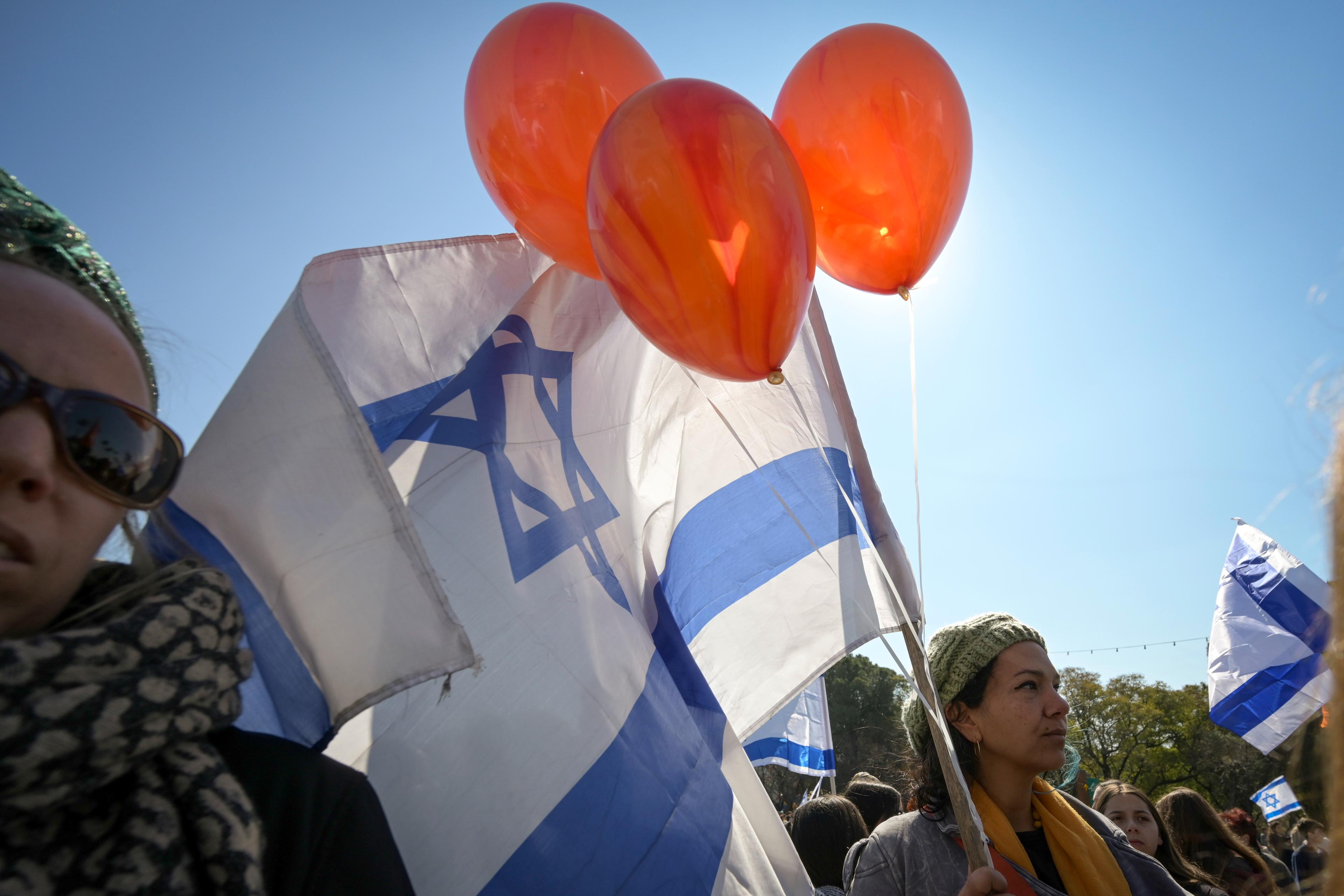 People pay their respects during the funeral service of late Israeli hostages Shiri Bibas and her children Ariel and Kfir, in the northern Israeli town of Katzrin, February 26, 2025. 