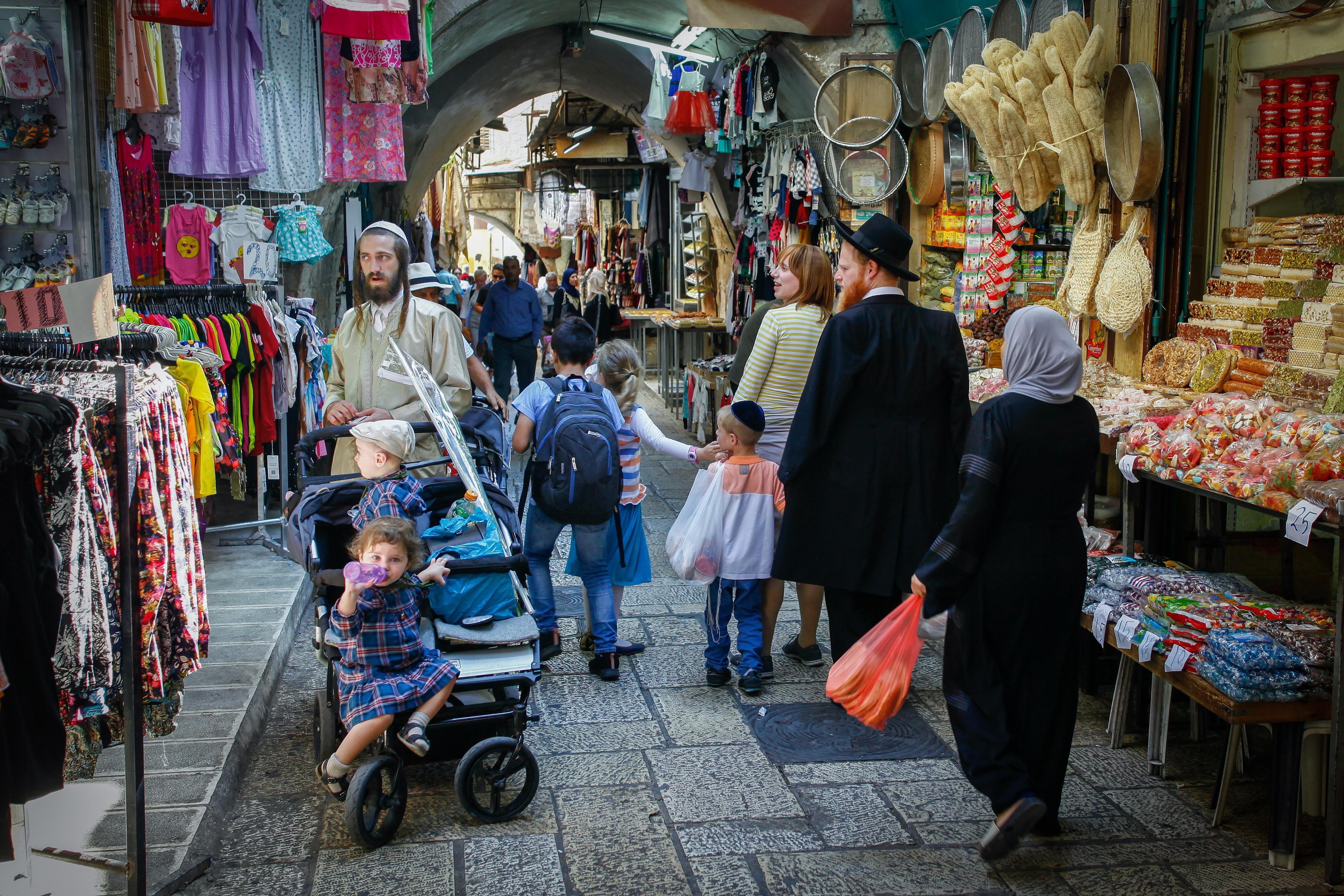 Arabs and Jews walking in the Old City Jerusalem