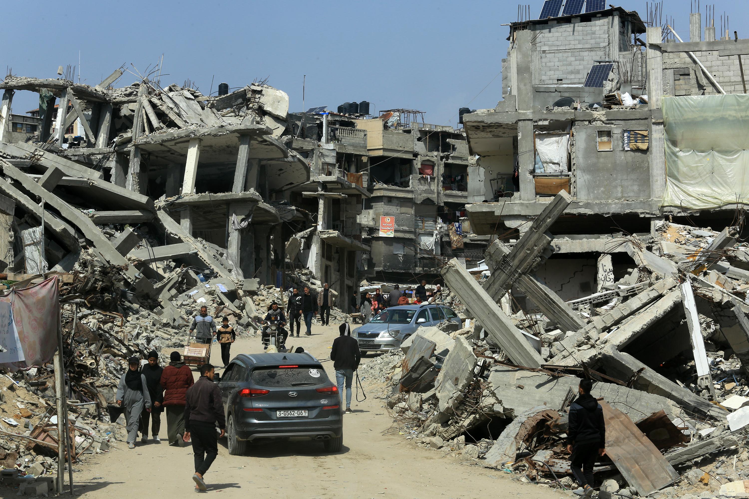 Palestinians live among the rubble of their homes which were destroyed in the war between Israel and Hamas, in the city of Khan Yunis, southern Gaza Strip