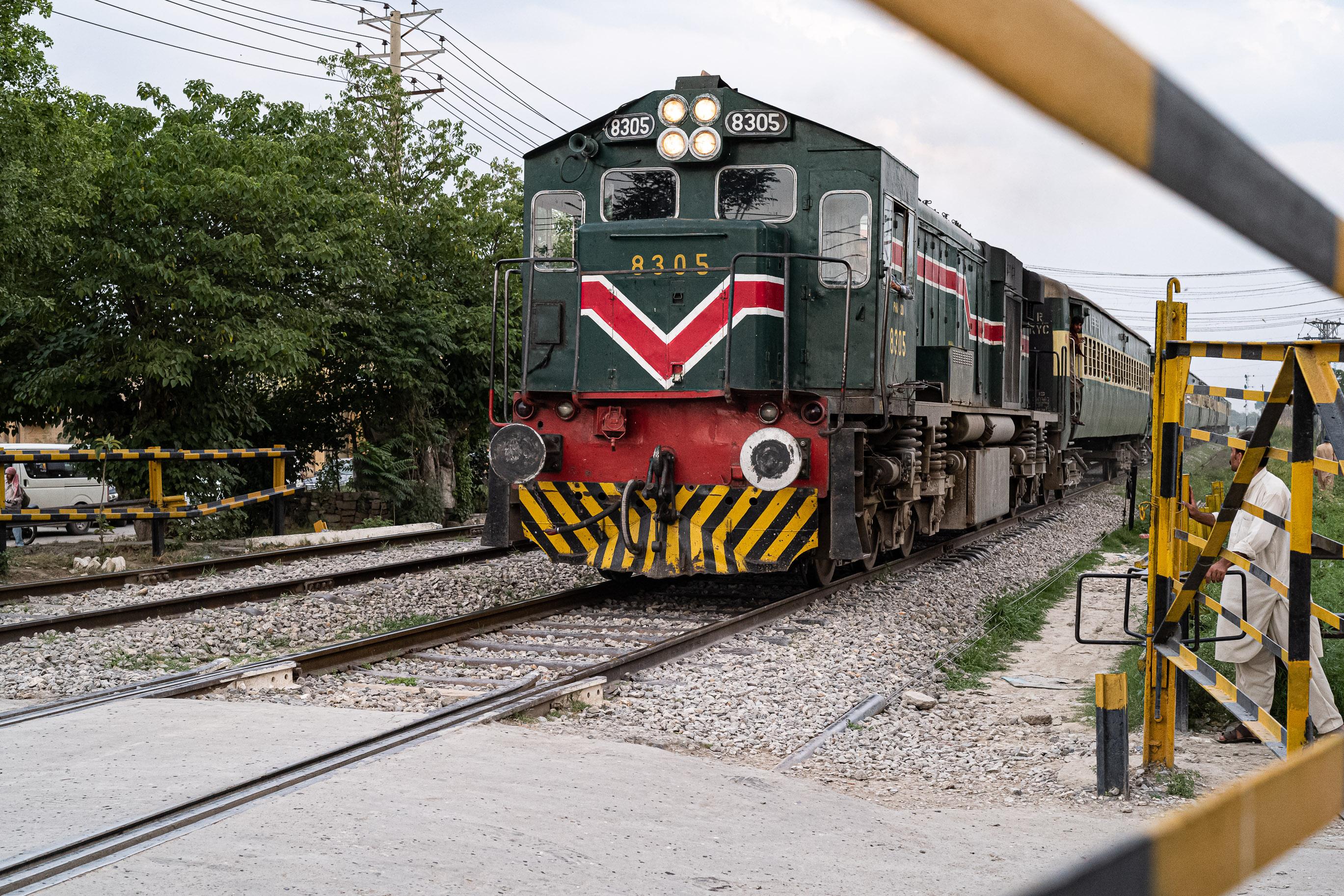 Pakistan train approaches railway crossing 