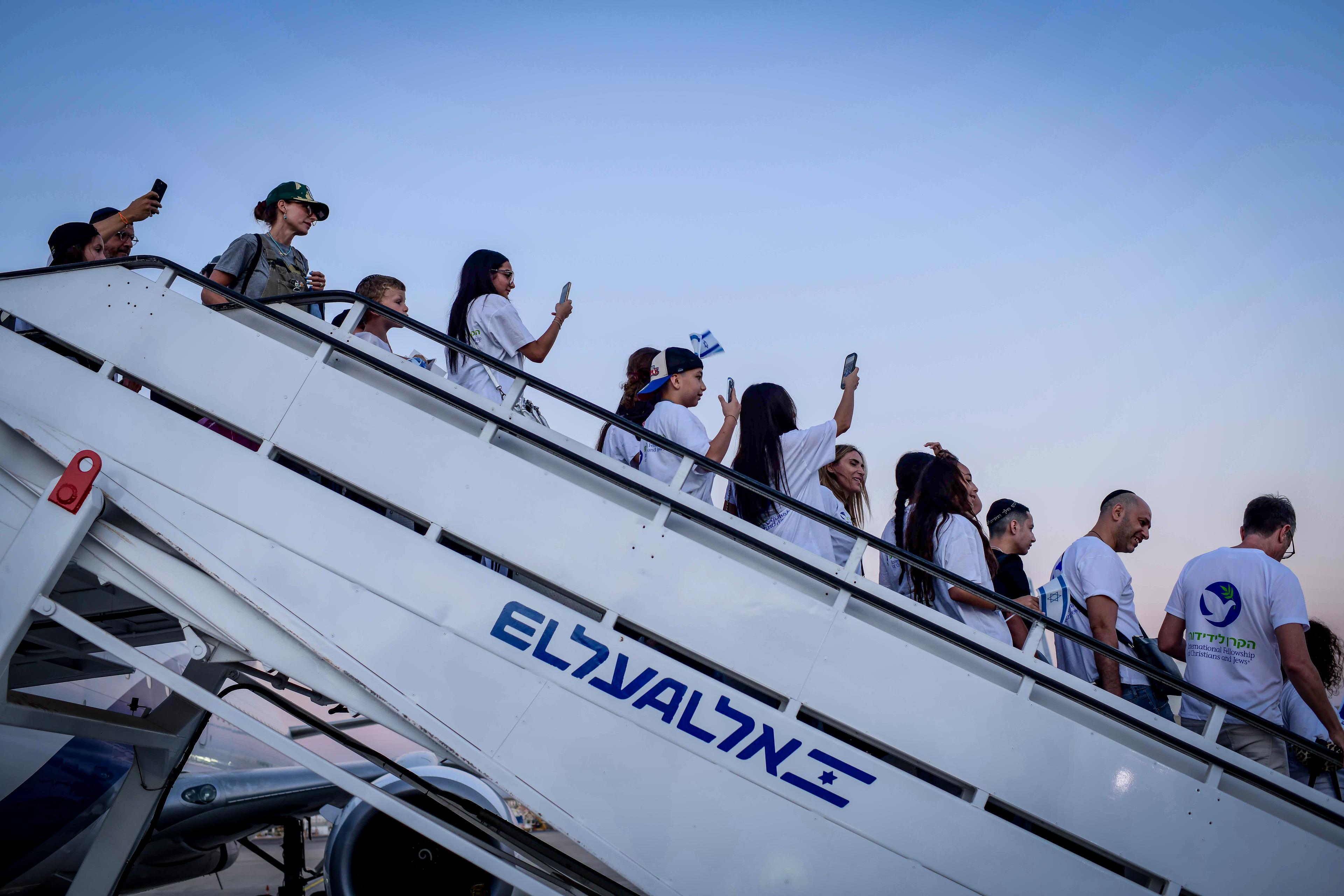 New immigrants from France arrive on a special " Aliyah Flight" at the Ben Gurion airport in central Israel on August 1, 2024. 