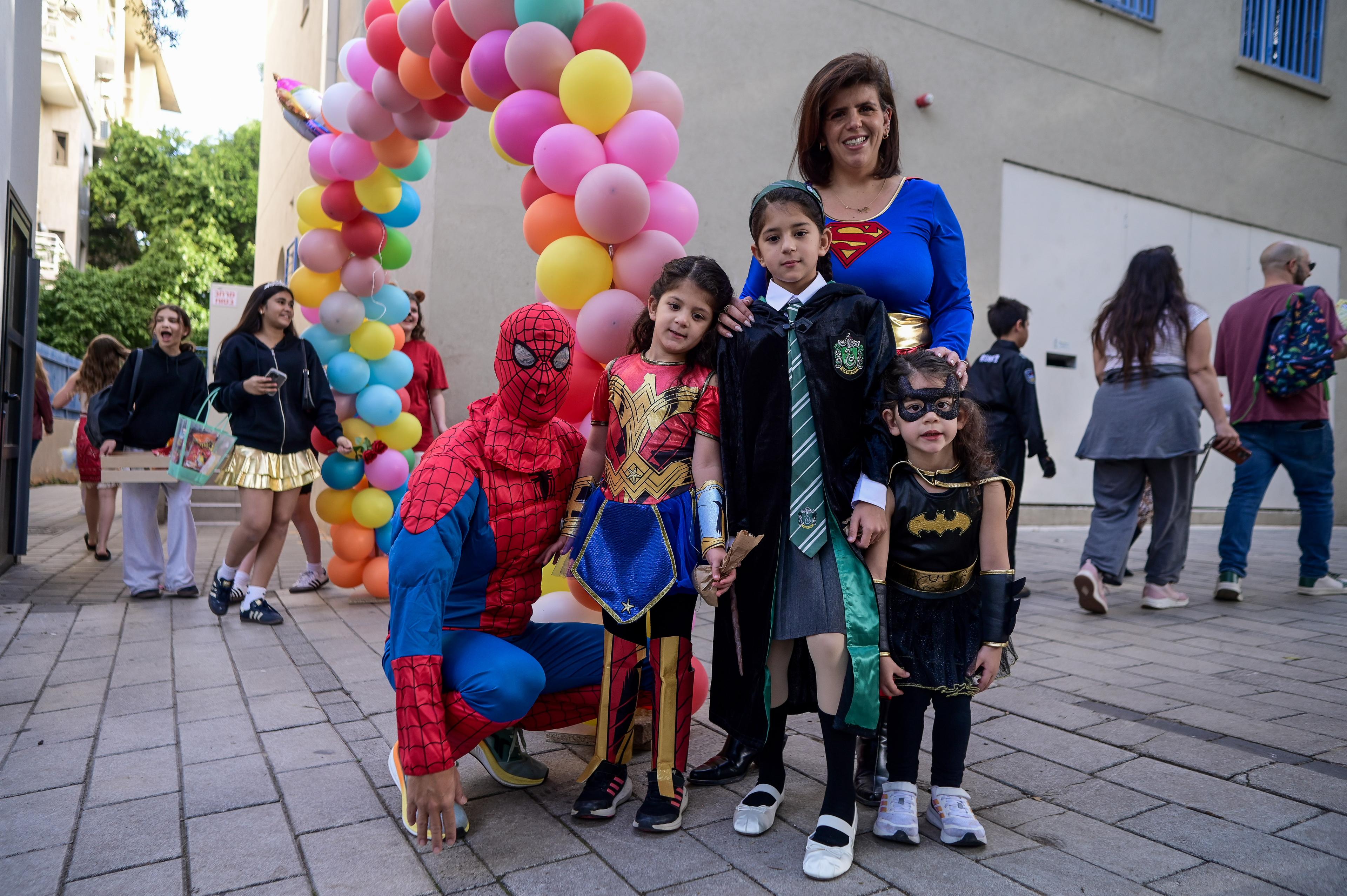 hool kids, their teachers and parents dressed up in costumes seen at the Gabrieli Carmel School in Tel Aviv, ahead of the the Jewish holiday of Purim, March 13, 2025. 