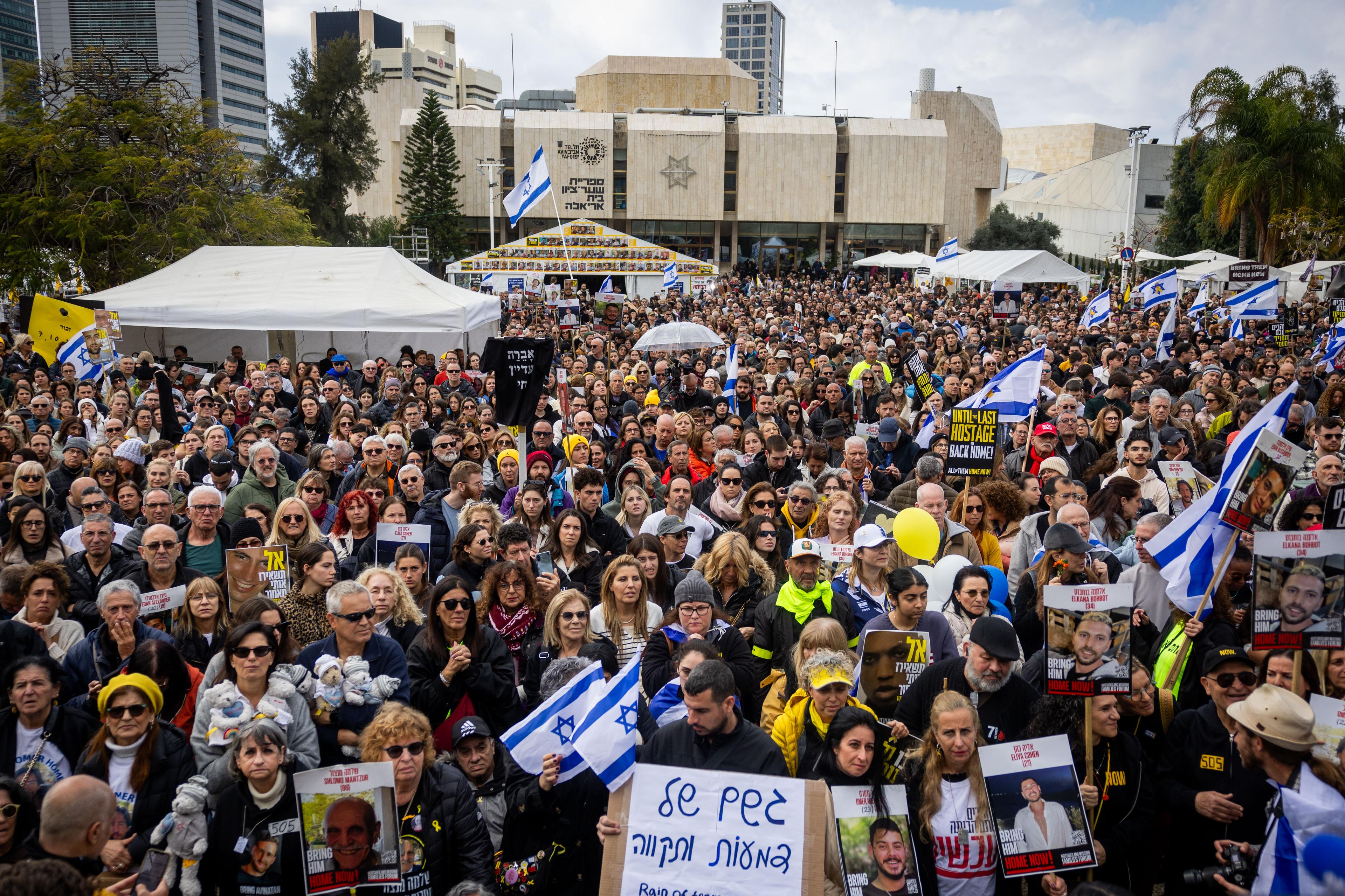 Israelis watch the release of hostages from Hamas captivity as part of a deal between Israel and Hamas, at Hostage square in Tel Aviv, February 22, 2025. 