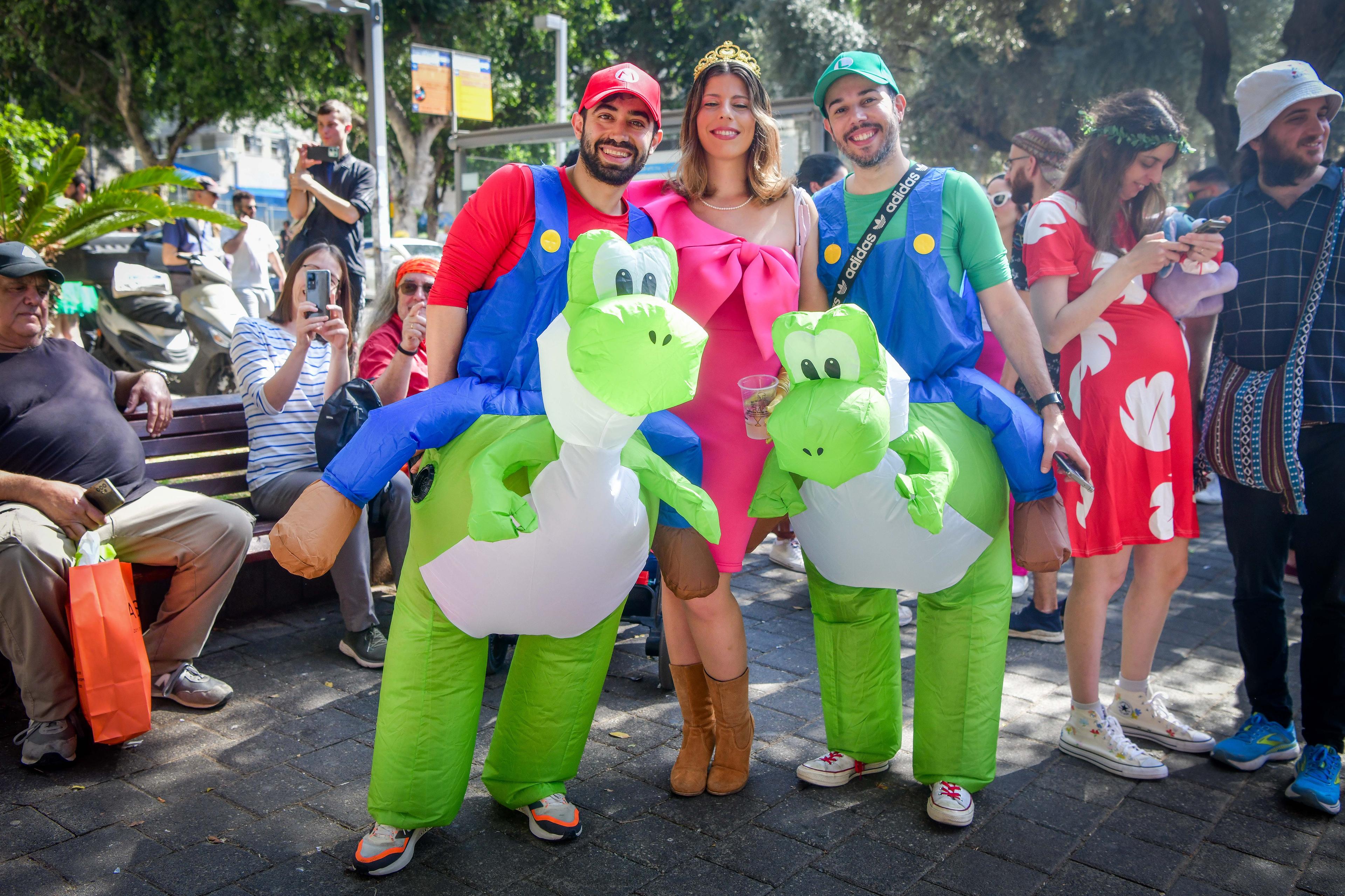 People wearing costumes celebrate the jewish holiday of Purim in Tel Aviv, March 14, 2025. People wearing costumes celebrate the jewish holiday of Purim in Tel Aviv, March 14, 2025.