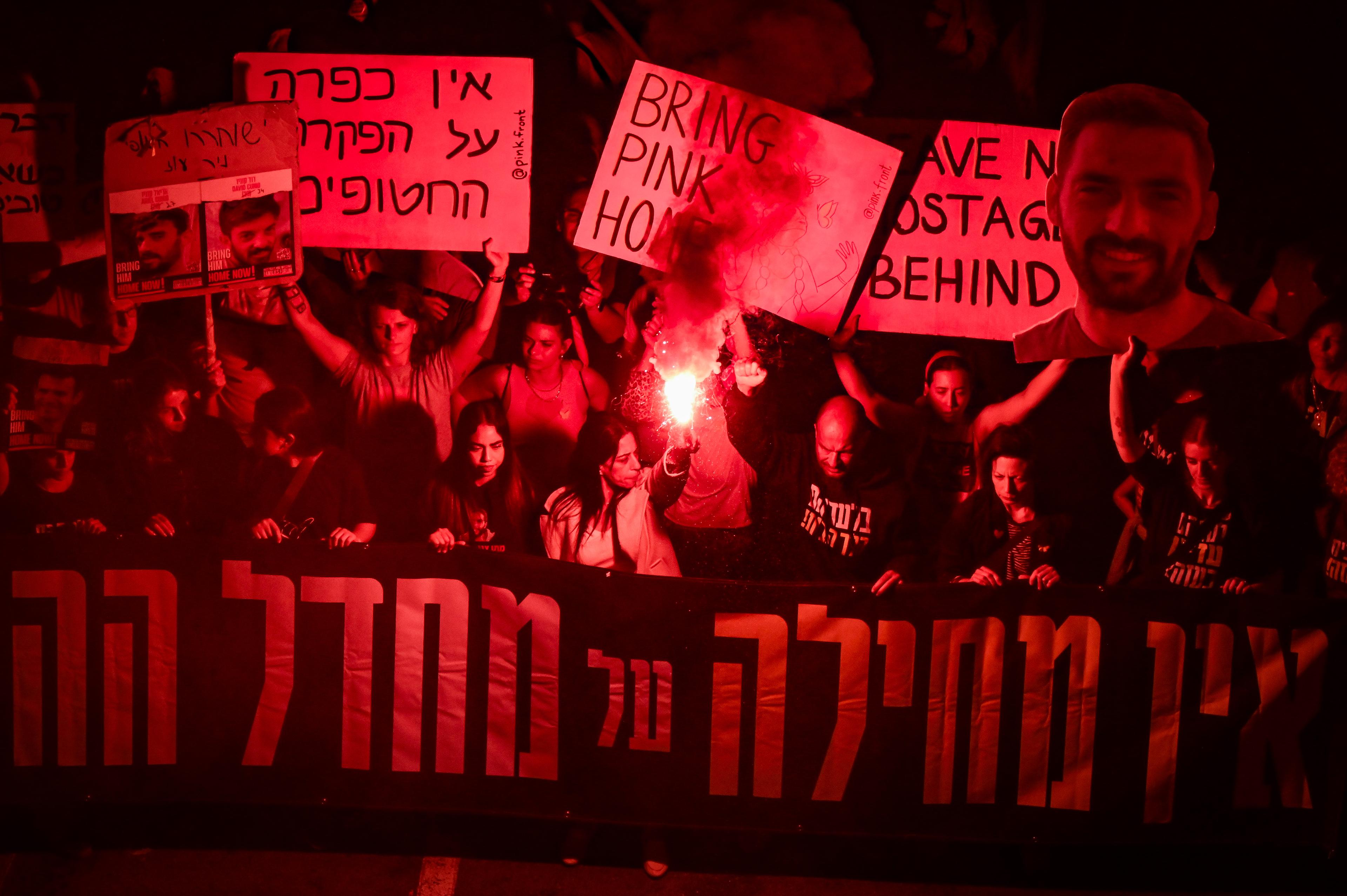 Demonstrators protest for the release of Israelis held hostage in the Gaza Strip, outside Hakirya Base in Tel Aviv, March 15, 2025. 
