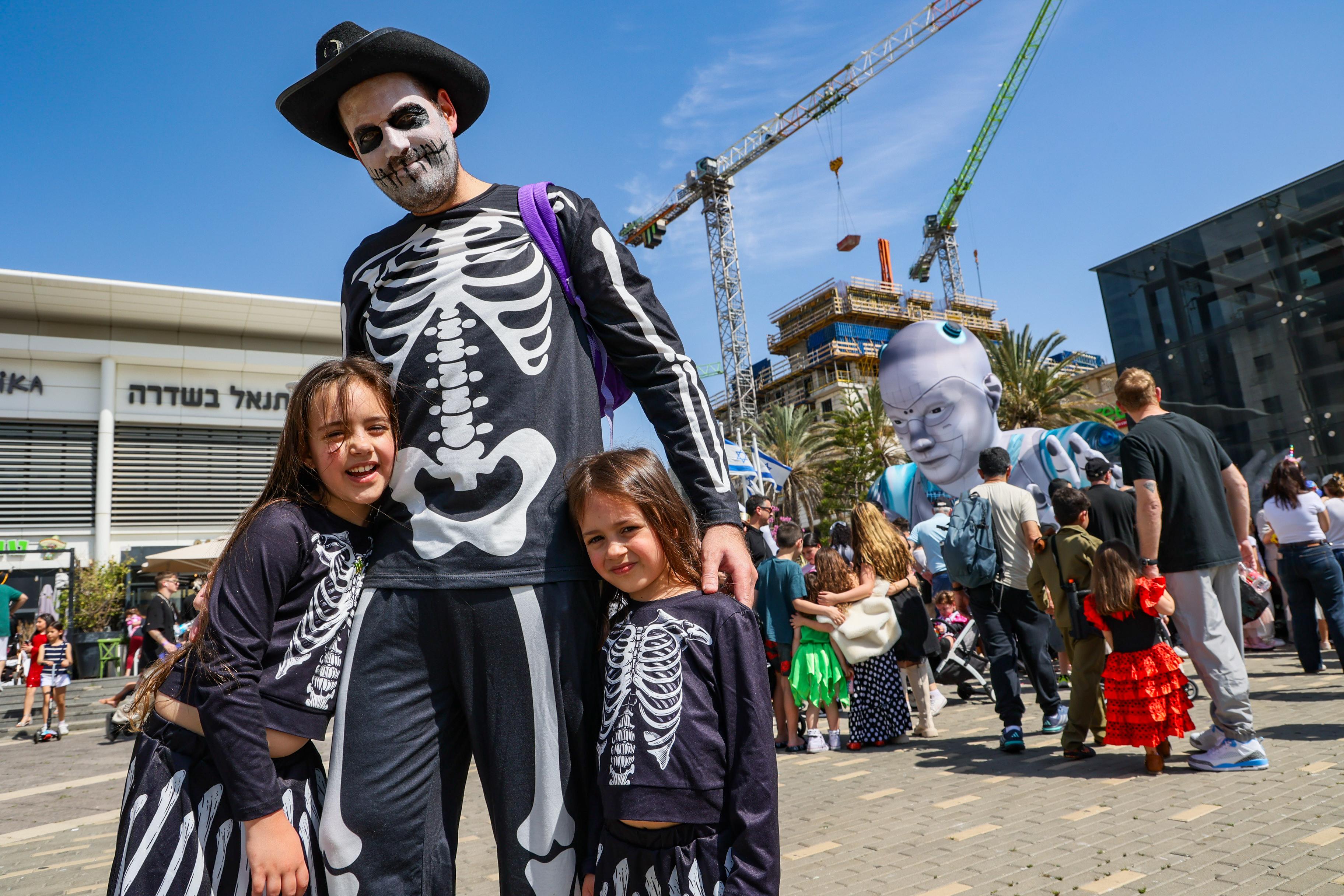 People wearing costumes celebrate the jewish holiday of Purim in Holon, March 14, 2025. People wearing costumes celebrate the jewish holiday of Purim in Holon, March 14, 2025.