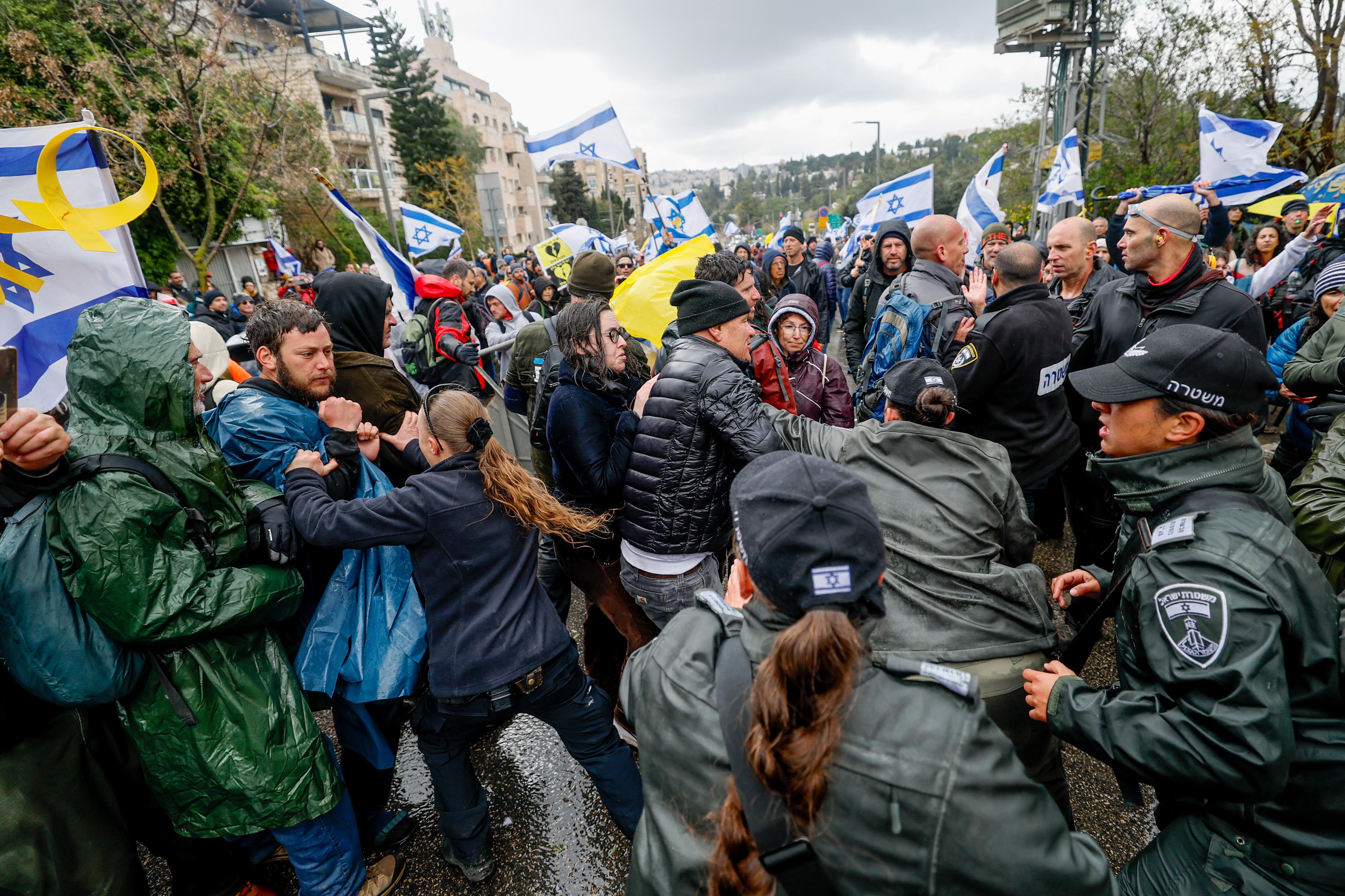 Israelis clash with police during a protest against the decision of Israeli prime minister Benjamin Netanyahu to fire head of Shin Bat Ronen Bar, in Jerusalem, March 20, 2025