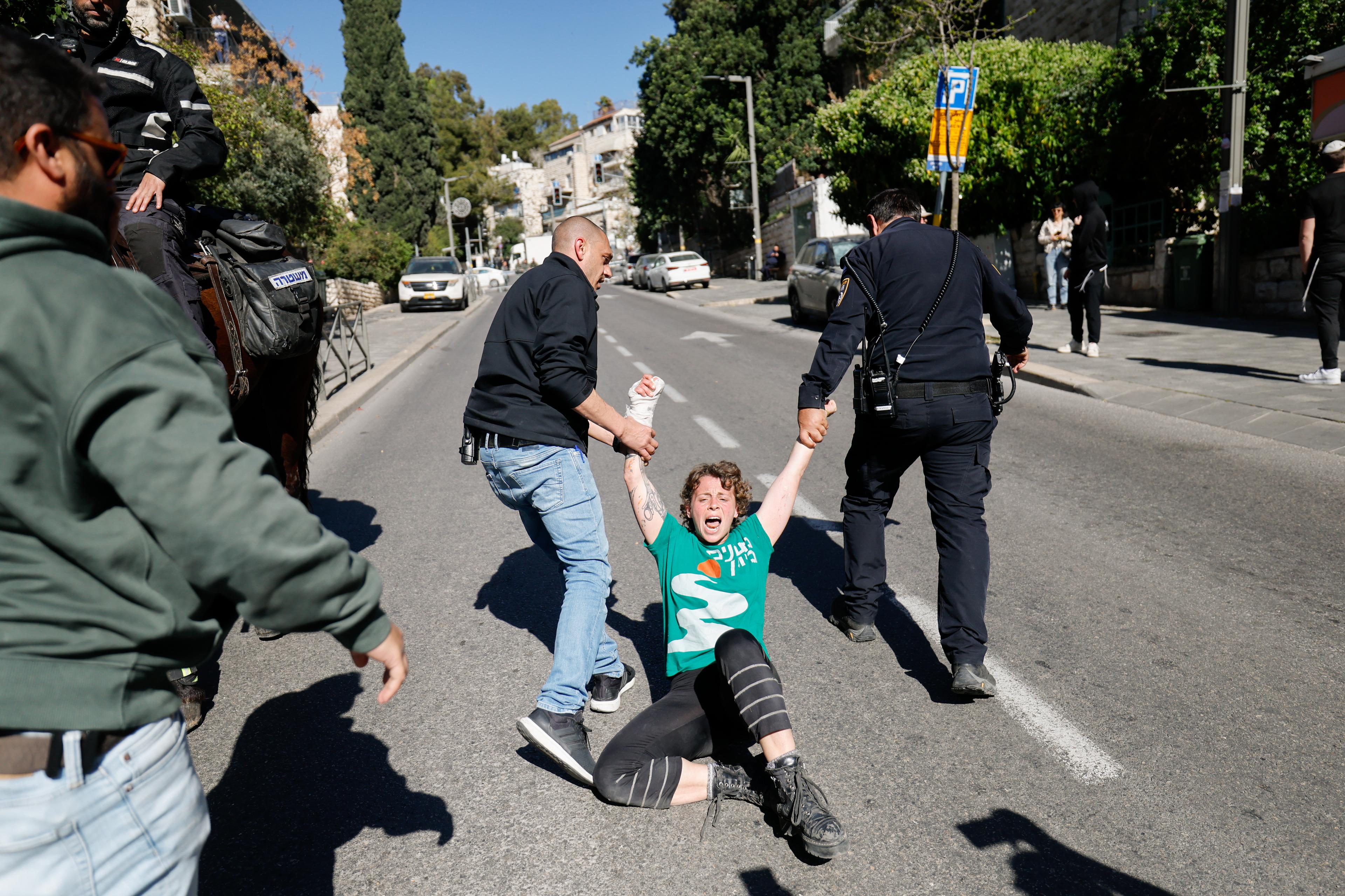 sraelis attending a protest march against the decision of Israeli prime minister Benjamin Netanyahu to fire head of Shin Bat Ronen Bar, clash with police in Jerusalem. March 19, 2025. 