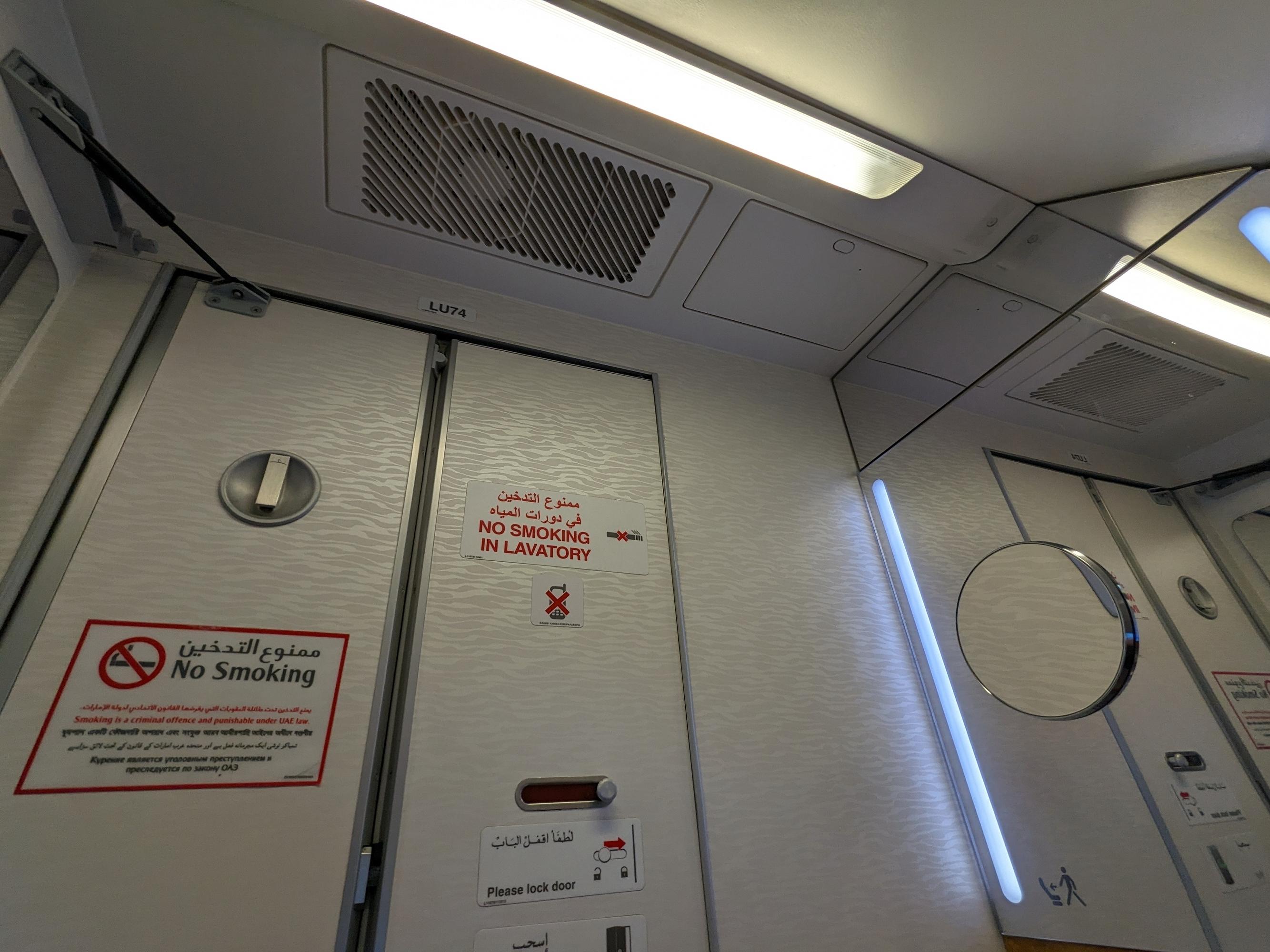The interior of an airplane toilet door