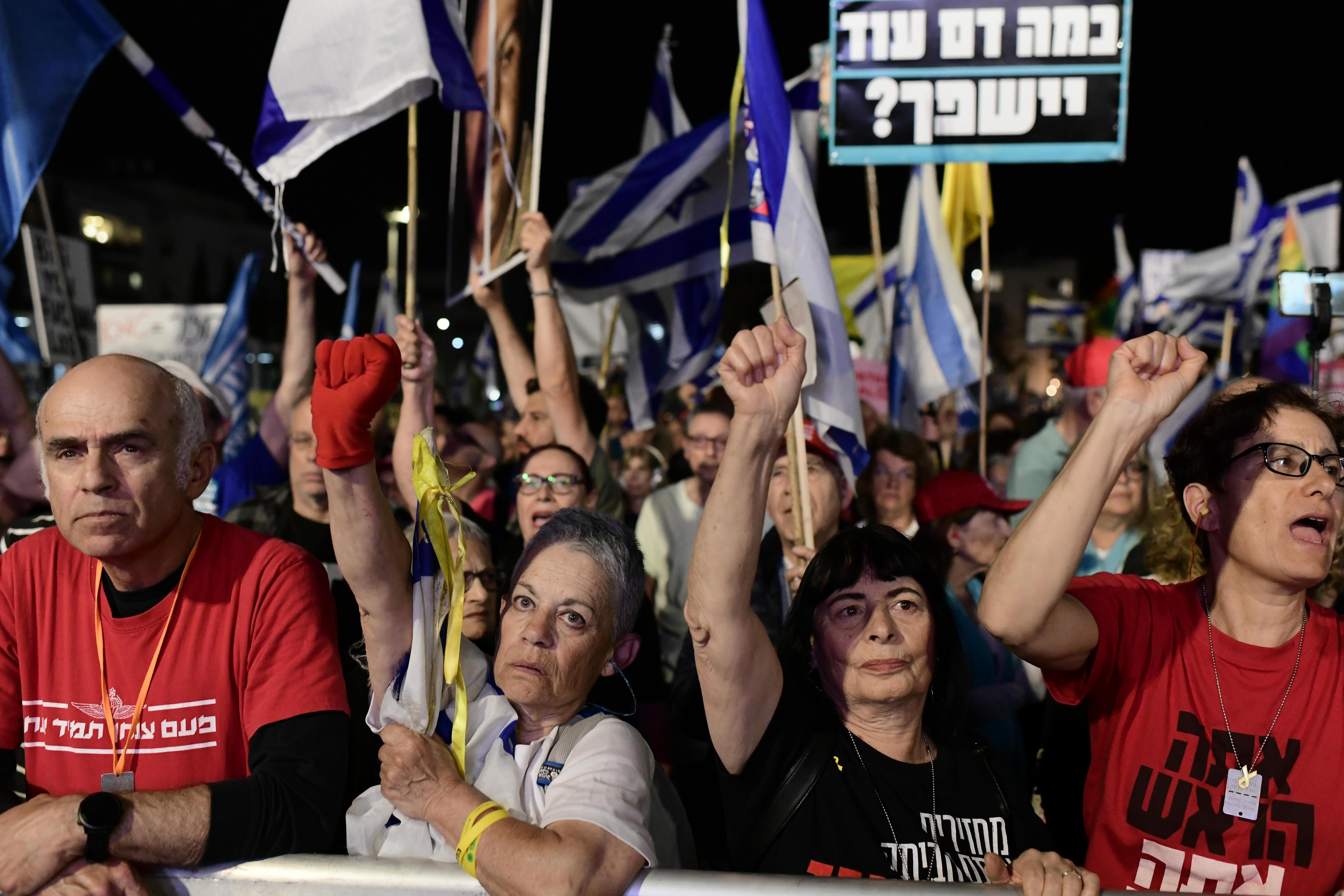 People protest against Prime Minister Benjamin Netanyahu and his government, at Habima Square, March 27, 2025. 