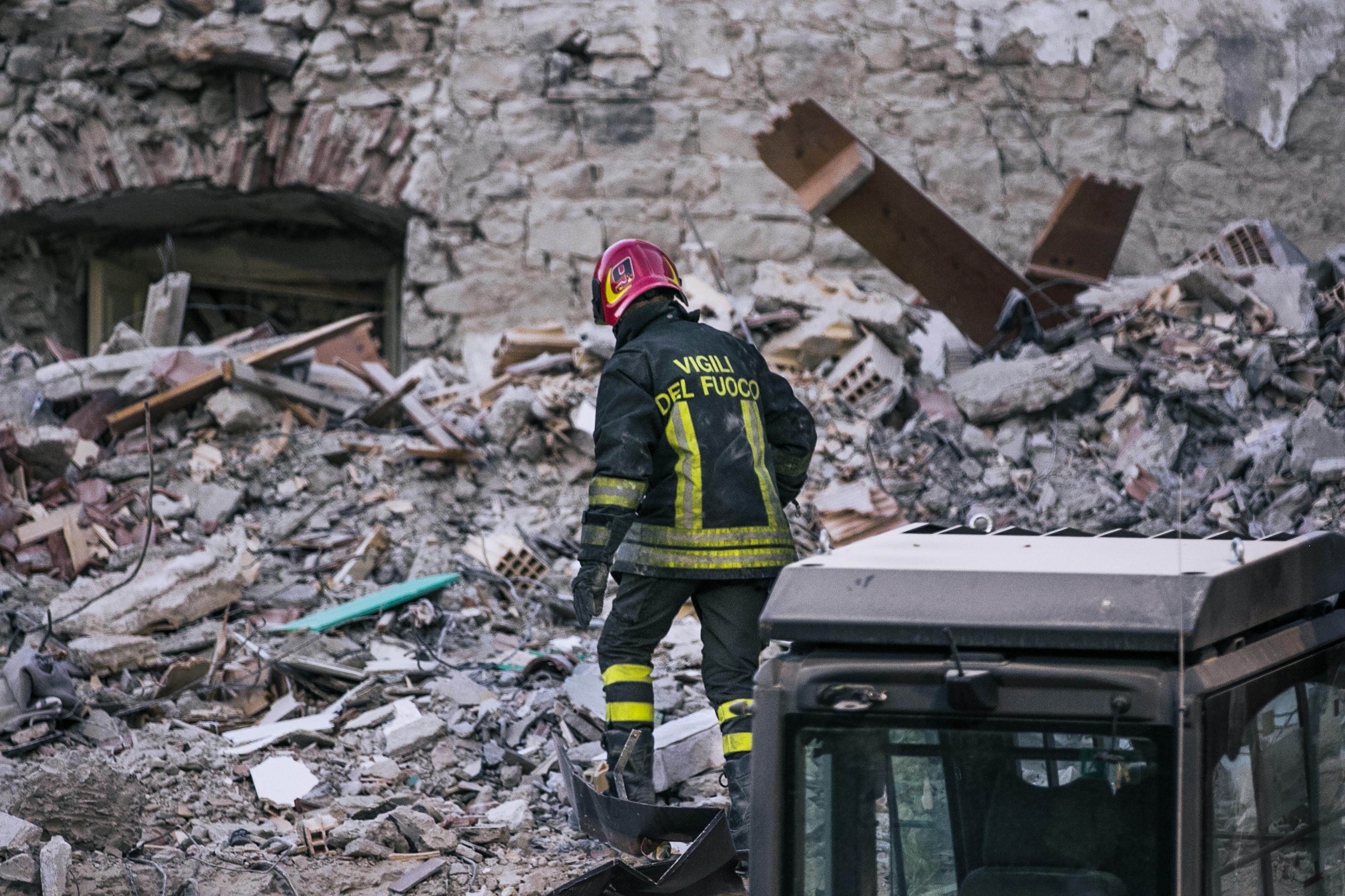 Rescue team member working through the rubble following the earthquake
