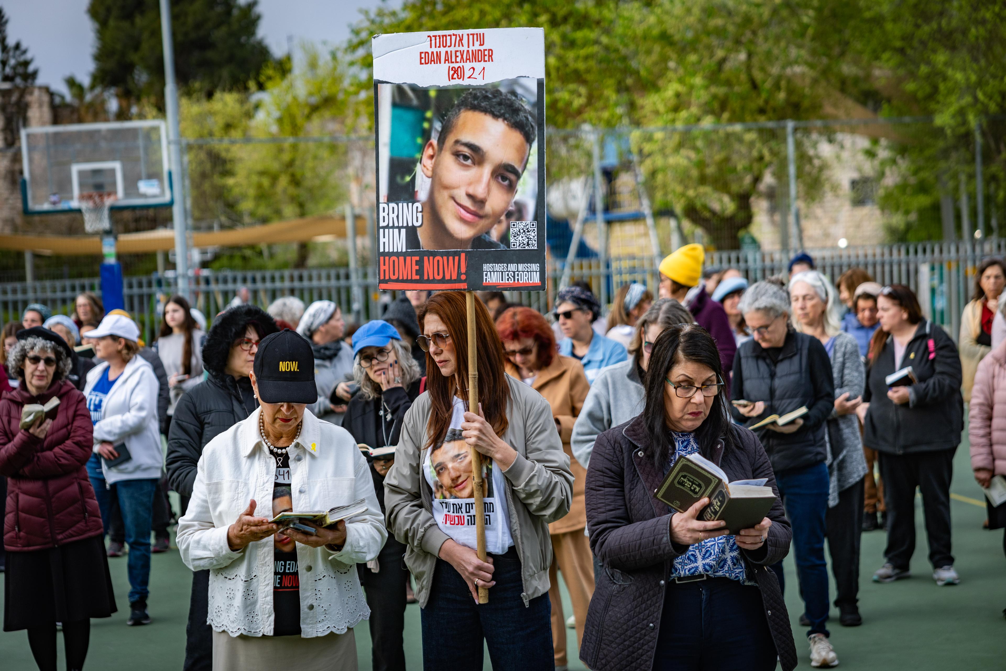 Families of Israelis held hostage in Gaza and supporters pray for the release of hostages held in Gaza, outside the home of Minister of Strategic Affairs Ron Dermer in Jerusalem on March 30, 2025.