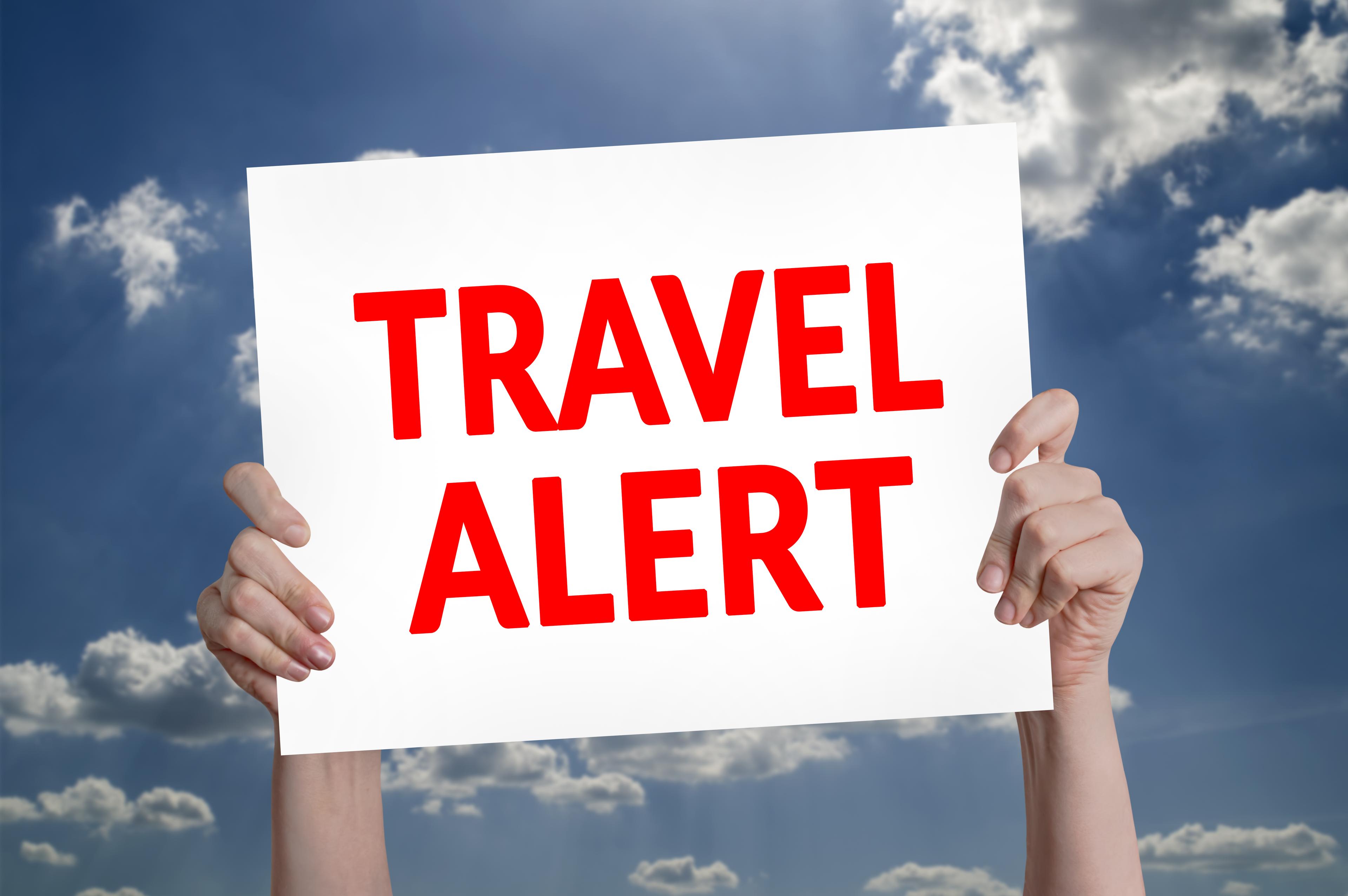Travel Alert card with cloud background 