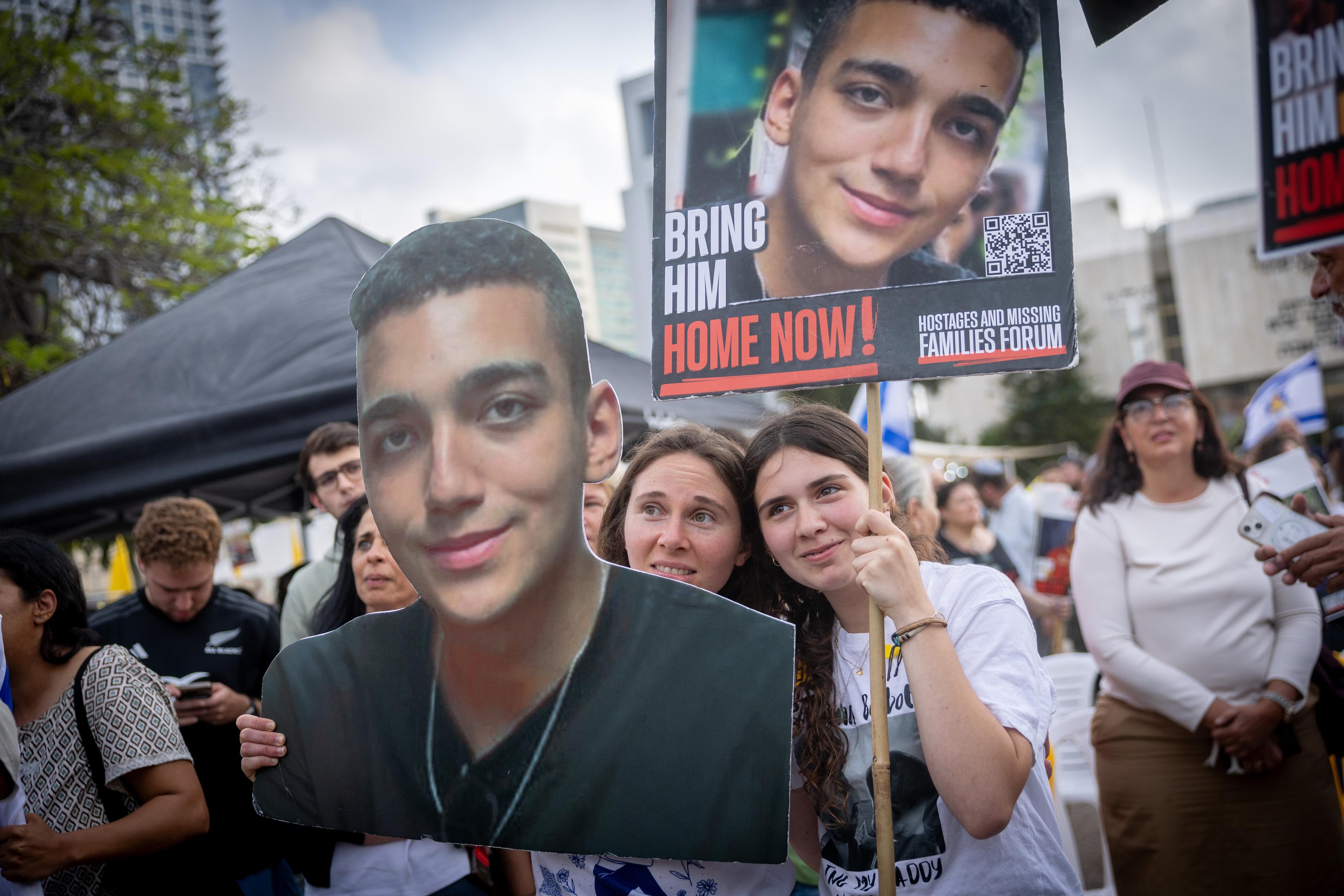 Israelis await the release of Israeli/US hostage Edan Alexander, whom Hamas is expected to release from captivity today, at Hostage Square in Tel Aviv May 12, 2025.