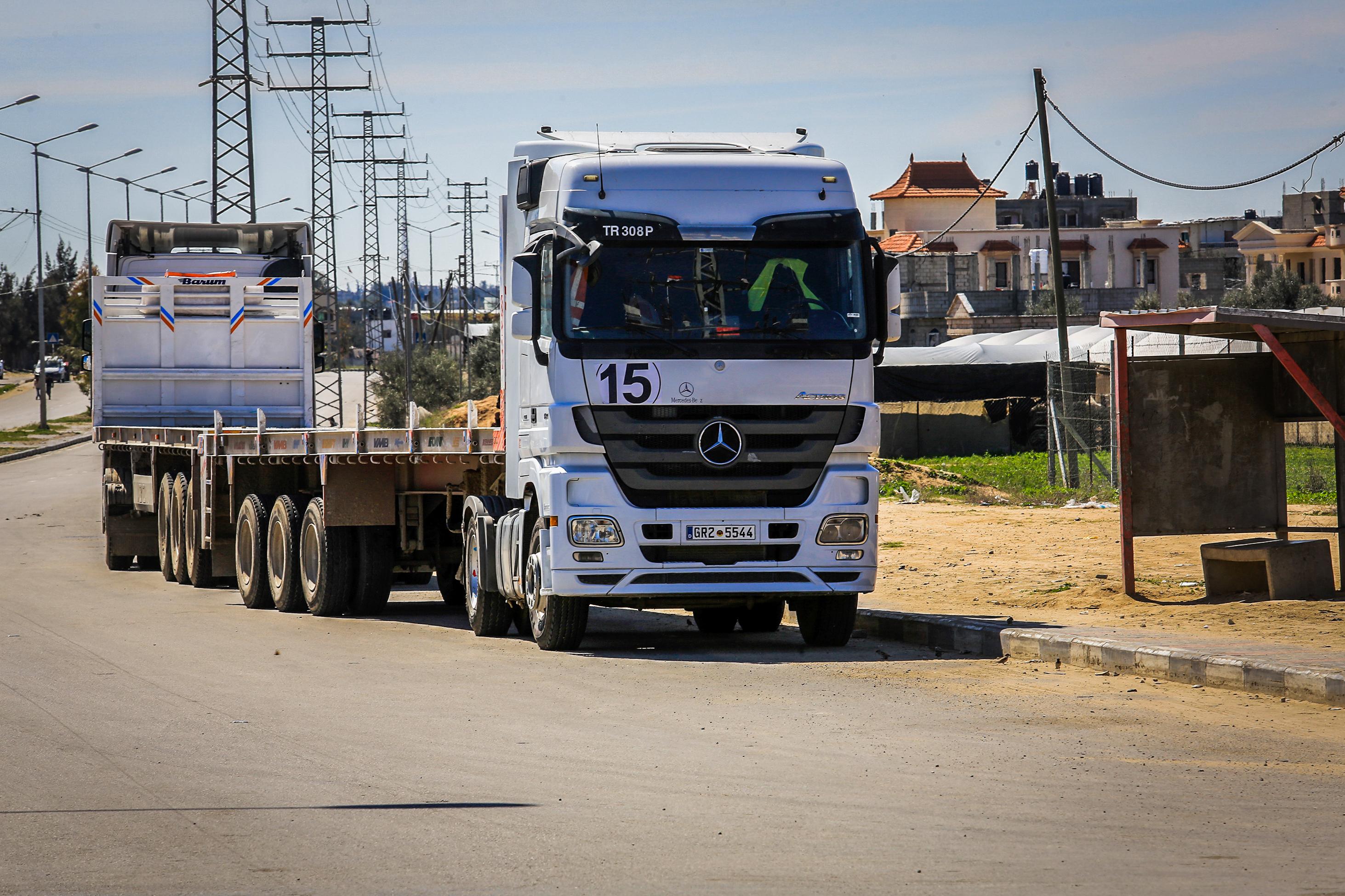 Palestinian trucks parked near the Kerem Shalom crossing, March 2, 2025 